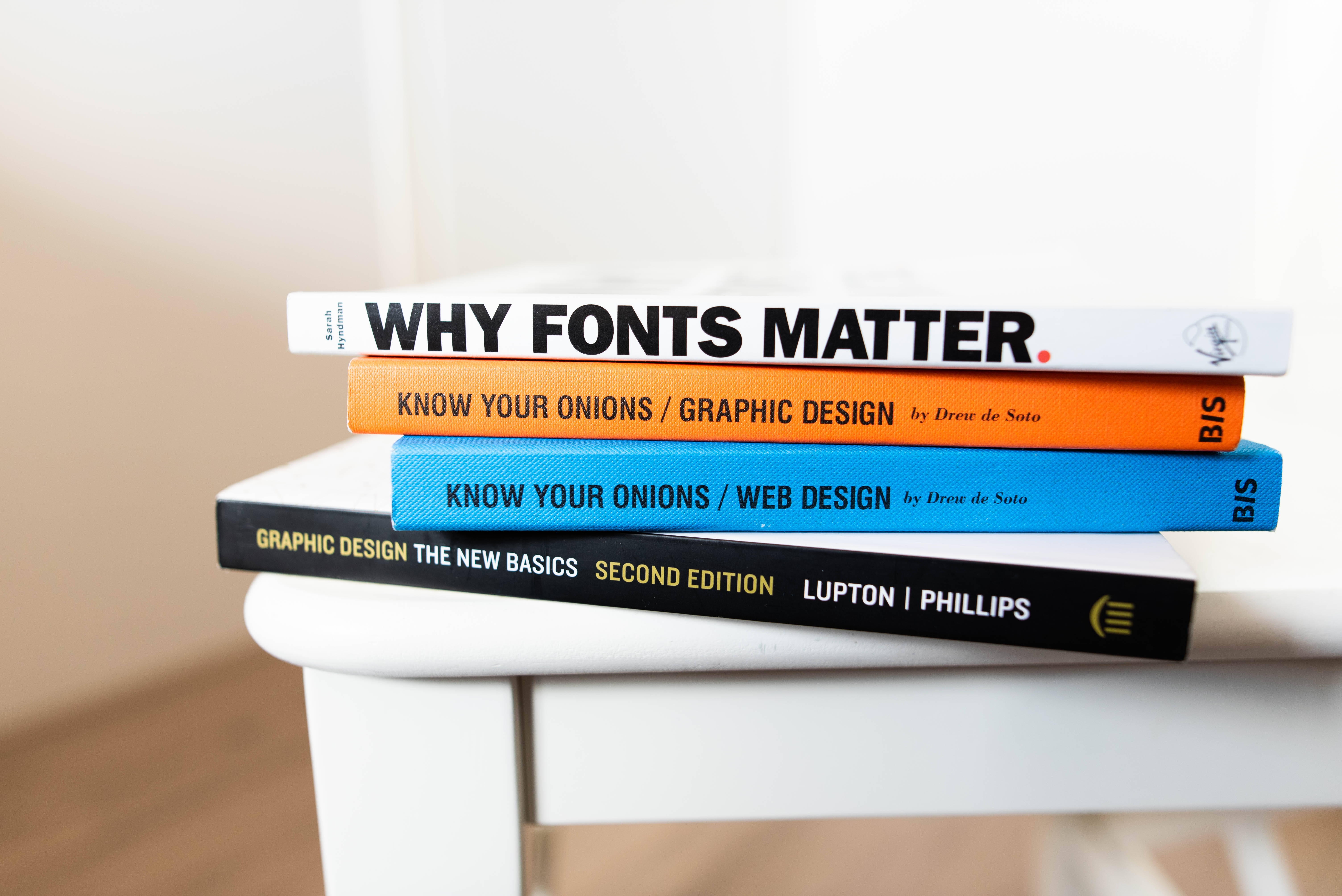 Why Fonts Matter, book stack, colorful graphic design books, 5K Desktop Wallpaper