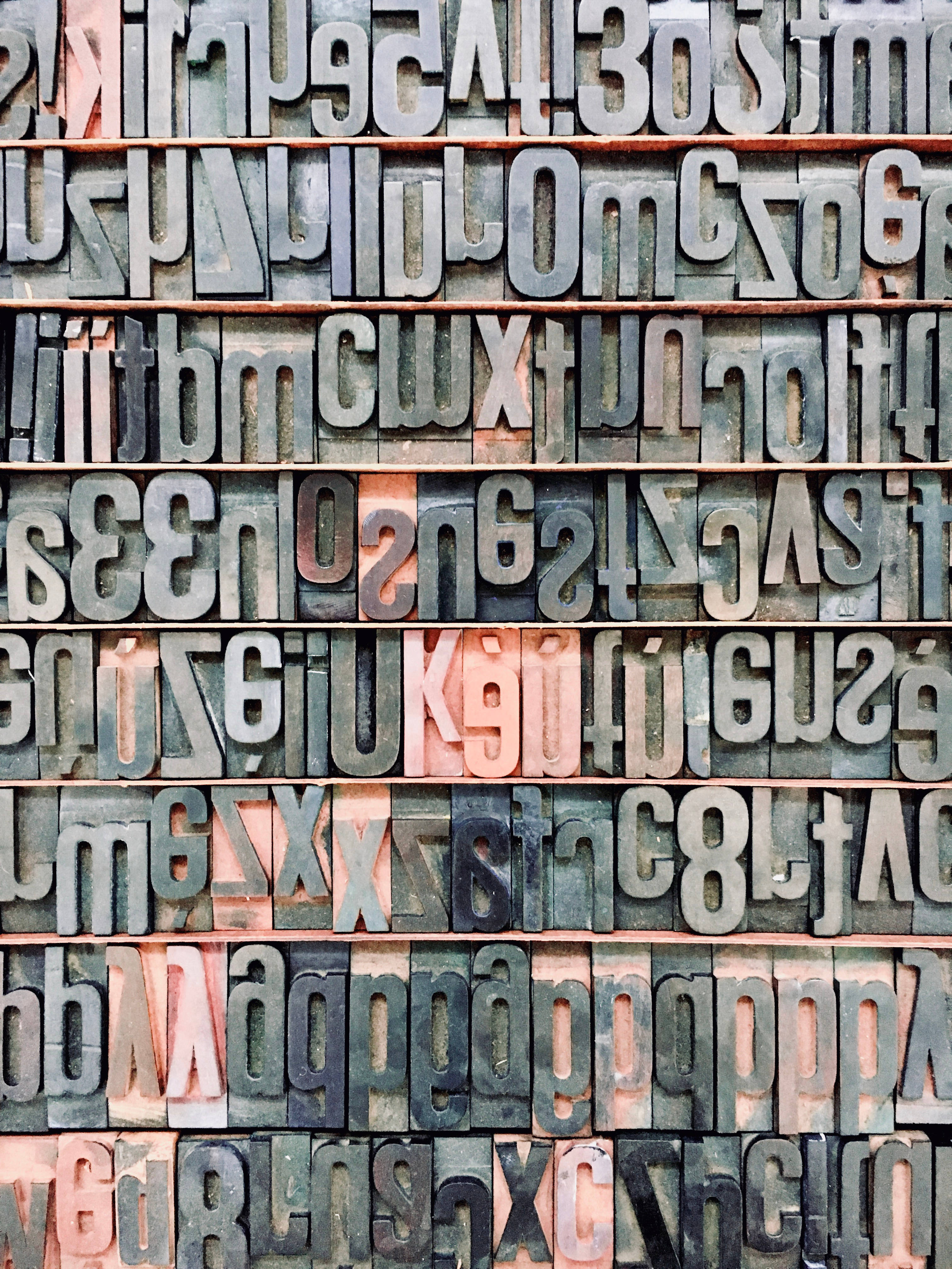 letterpress type blocks, muted grays, rusty reds, 4K Phone Wallpaper