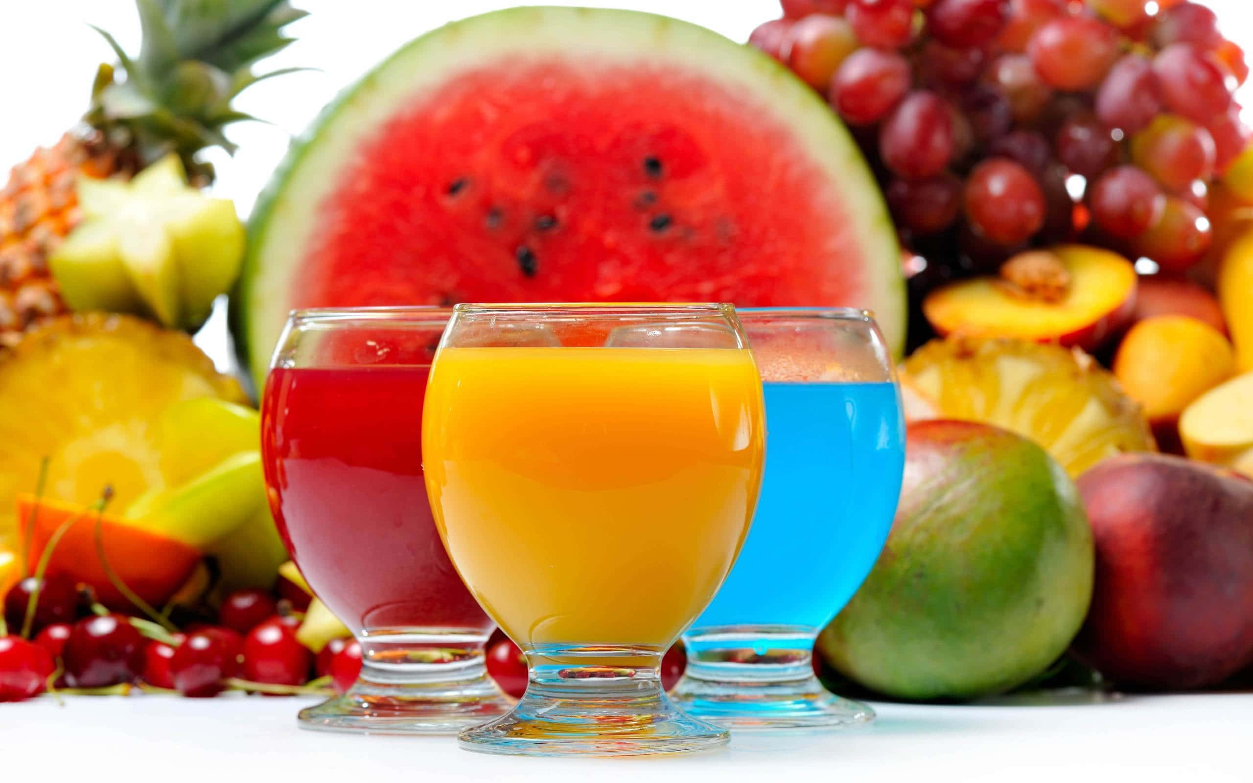 Food And Beverage, three vibrant glasses of fruit juice, colorful bounty of fresh tropical fruits, 2K Desktop Wallpaper