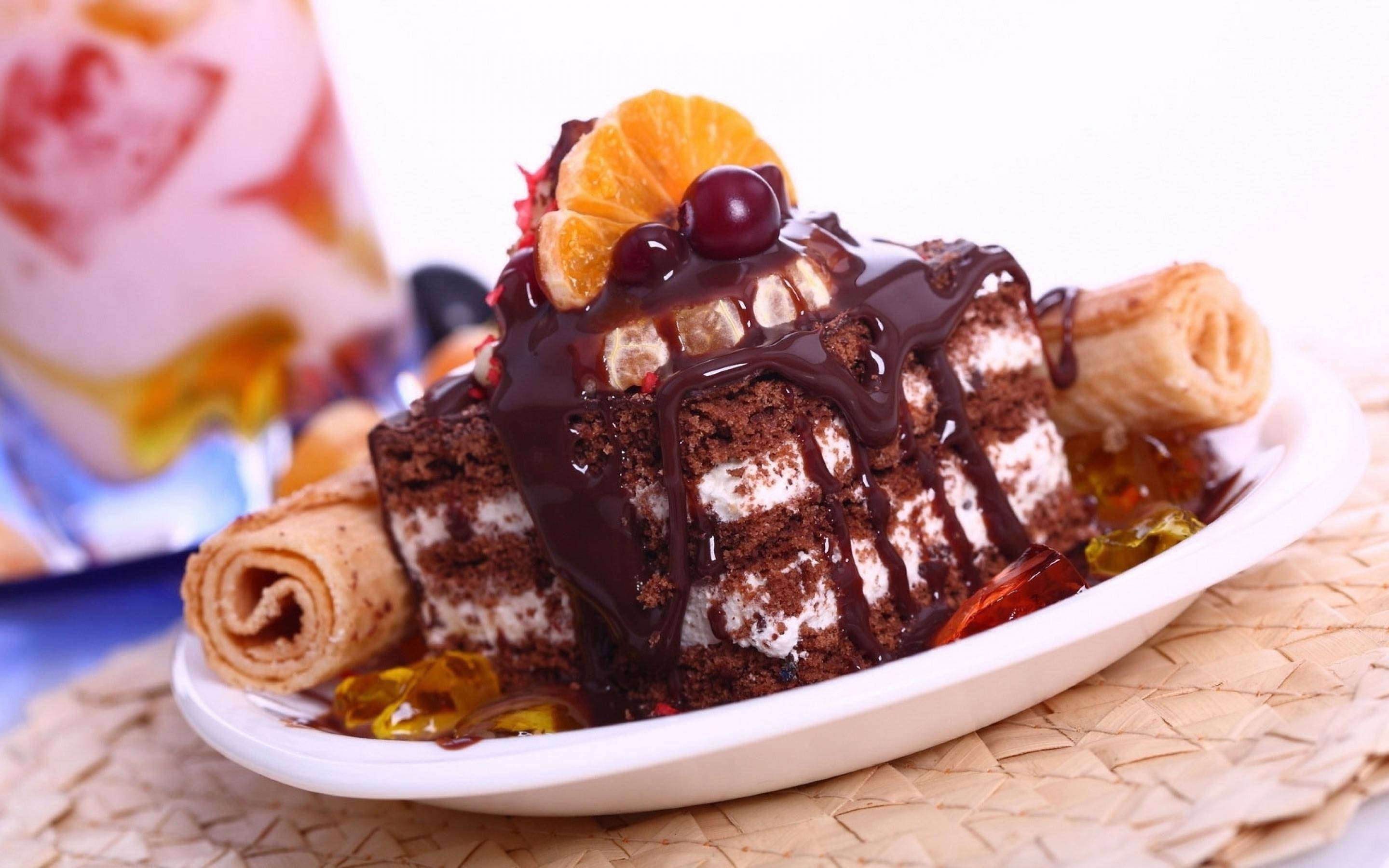 chocolate cake, glossy chocolate sauce, orange slice, 2K Desktop Wallpaper