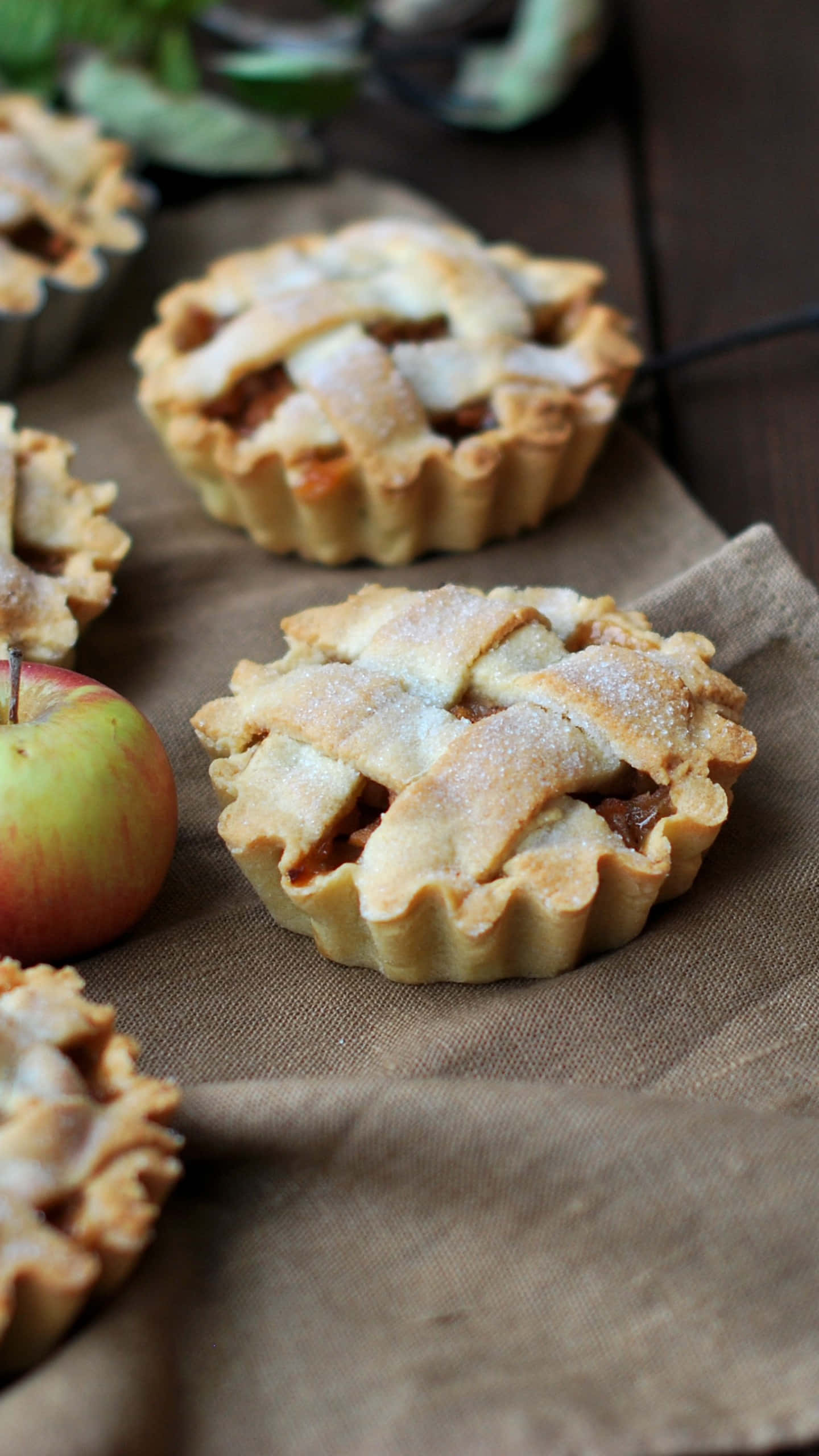 Mini Apple Pies, golden lattice-topped apple pies, rustic burlap cloth, 2K Phone Wallpaper