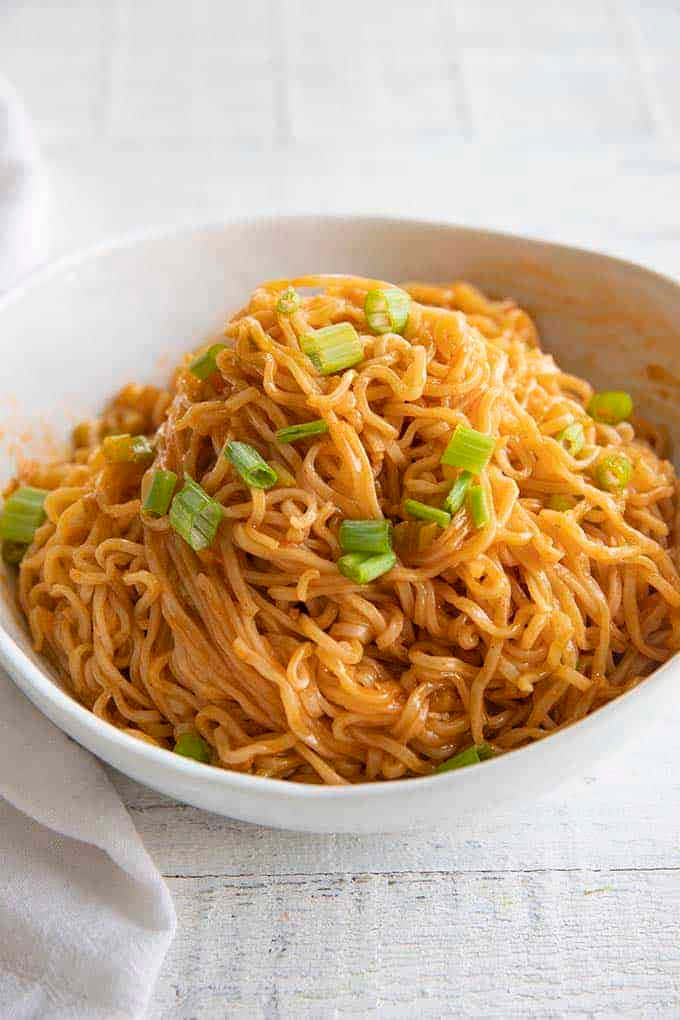 Firecracker Spicy Ramen Noodles, vibrant orange ramen noodles, fresh green scallions, SD Phone Wallpaper