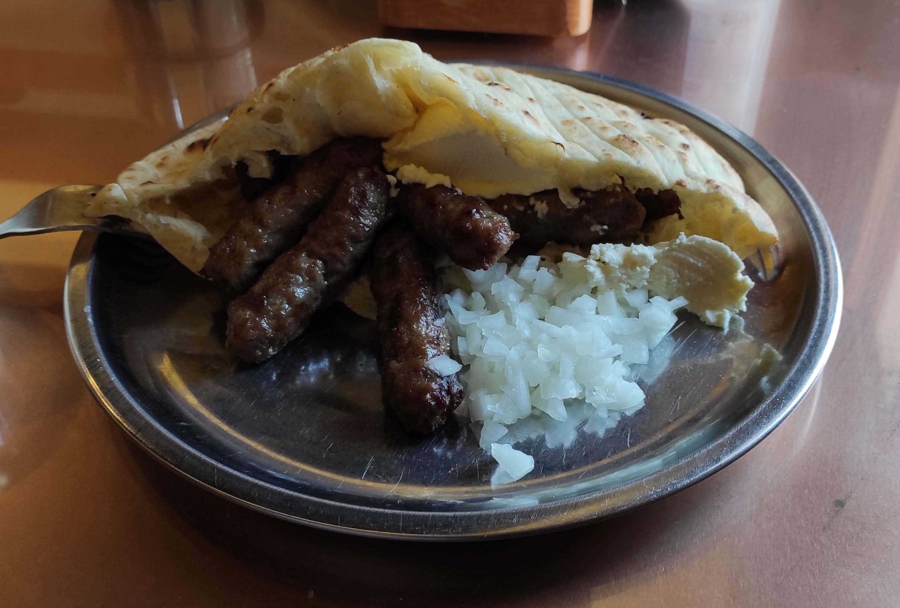 grilled cevapi, crispy pita bread, metal plate, 2K Desktop Wallpaper