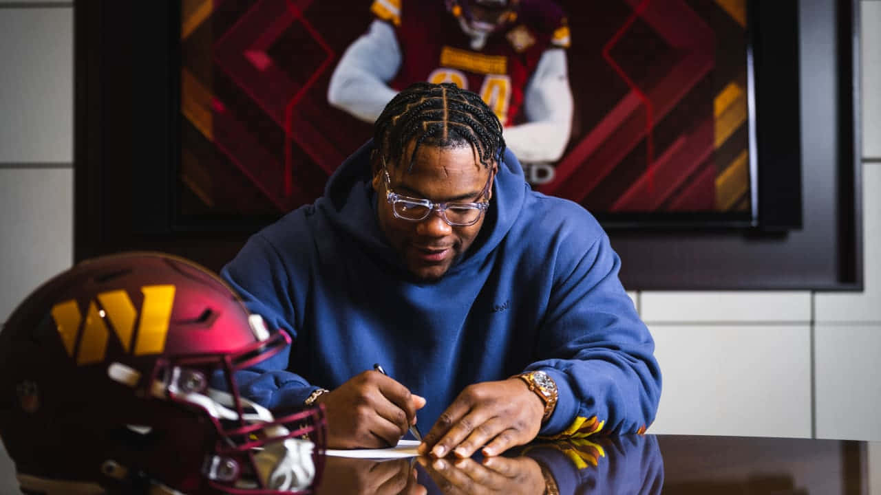 football player, blue hoodie, yellow W logo, HD Desktop Wallpaper