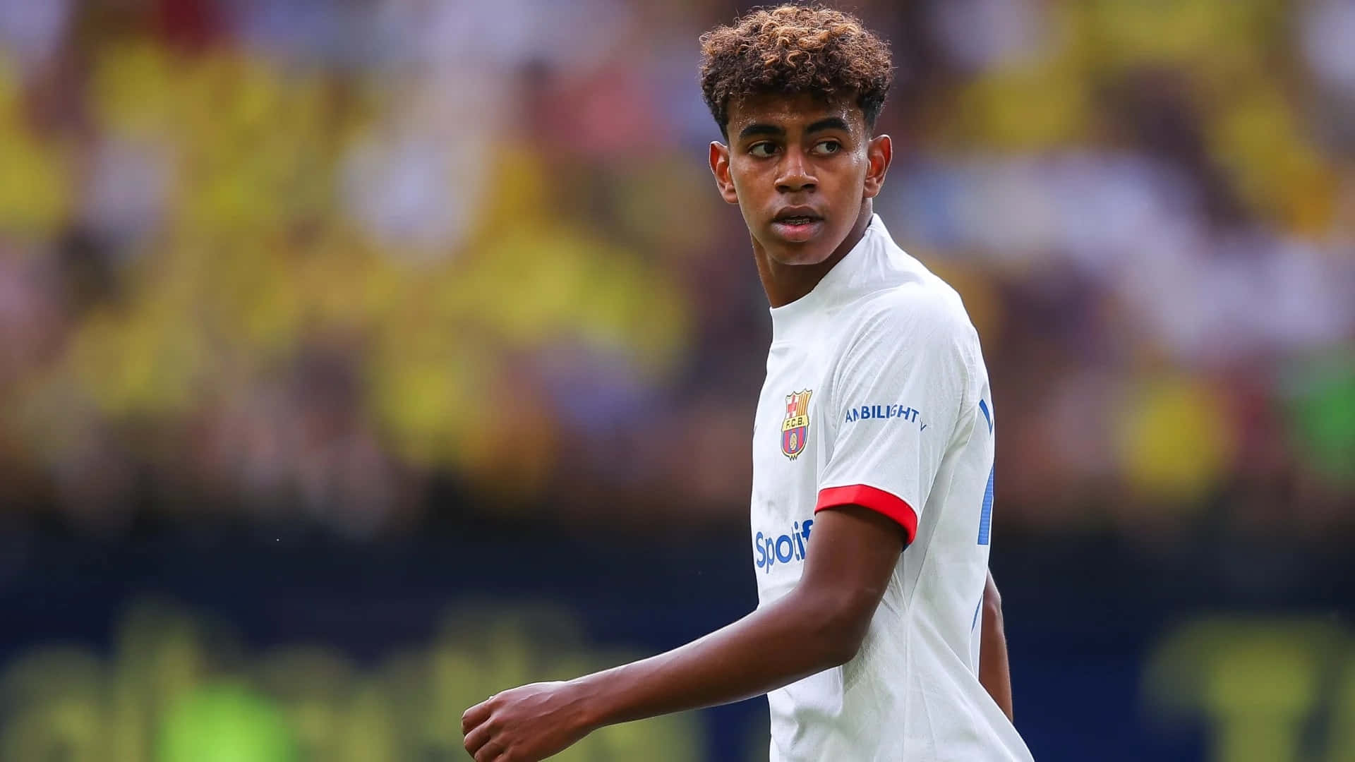 young footballer, white jersey with red accents, blurred crowd of yellow-clad fans, Full HD Desktop Wallpaper