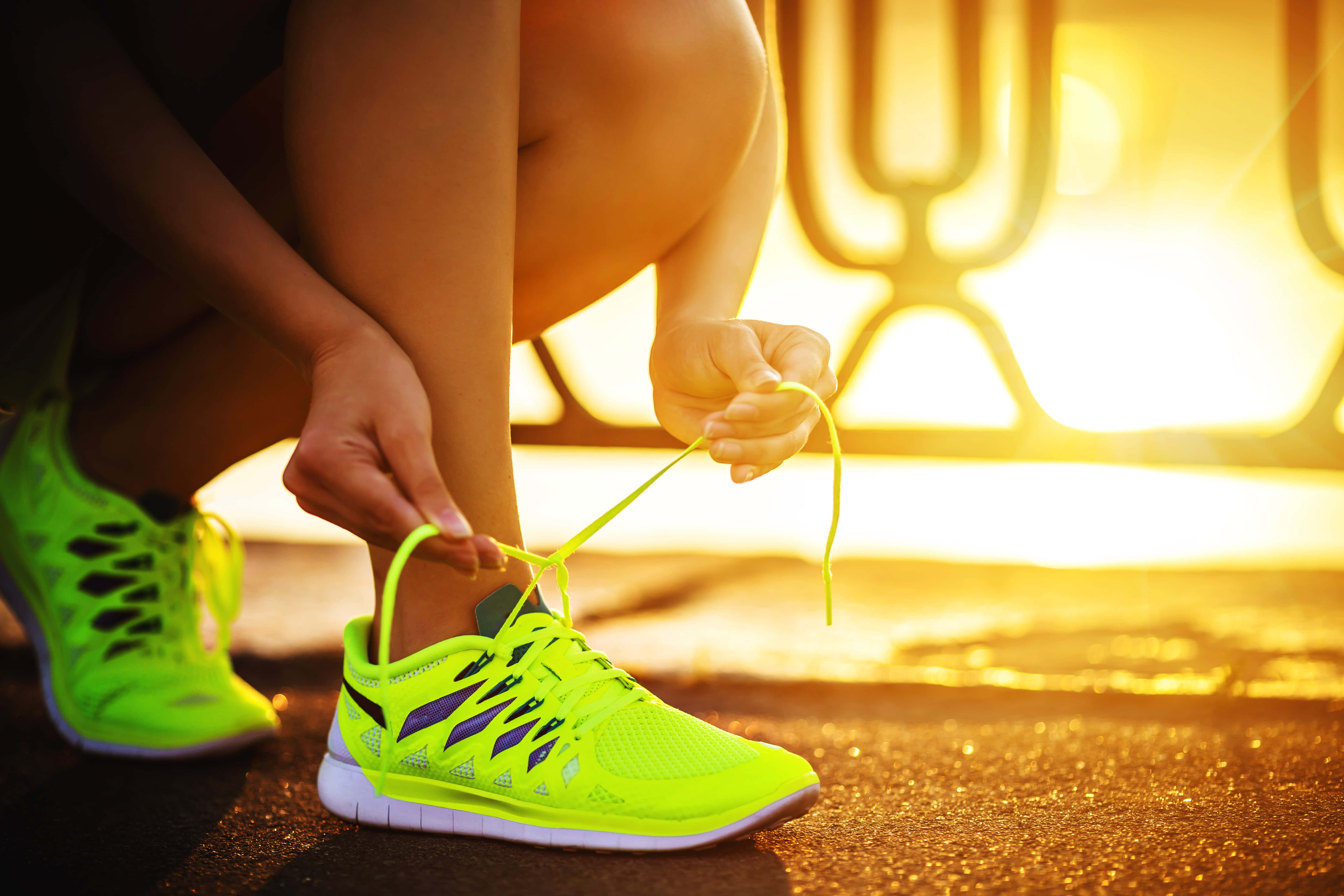 neon green running shoes, golden hour, warm sunlight, 5K Desktop Wallpaper