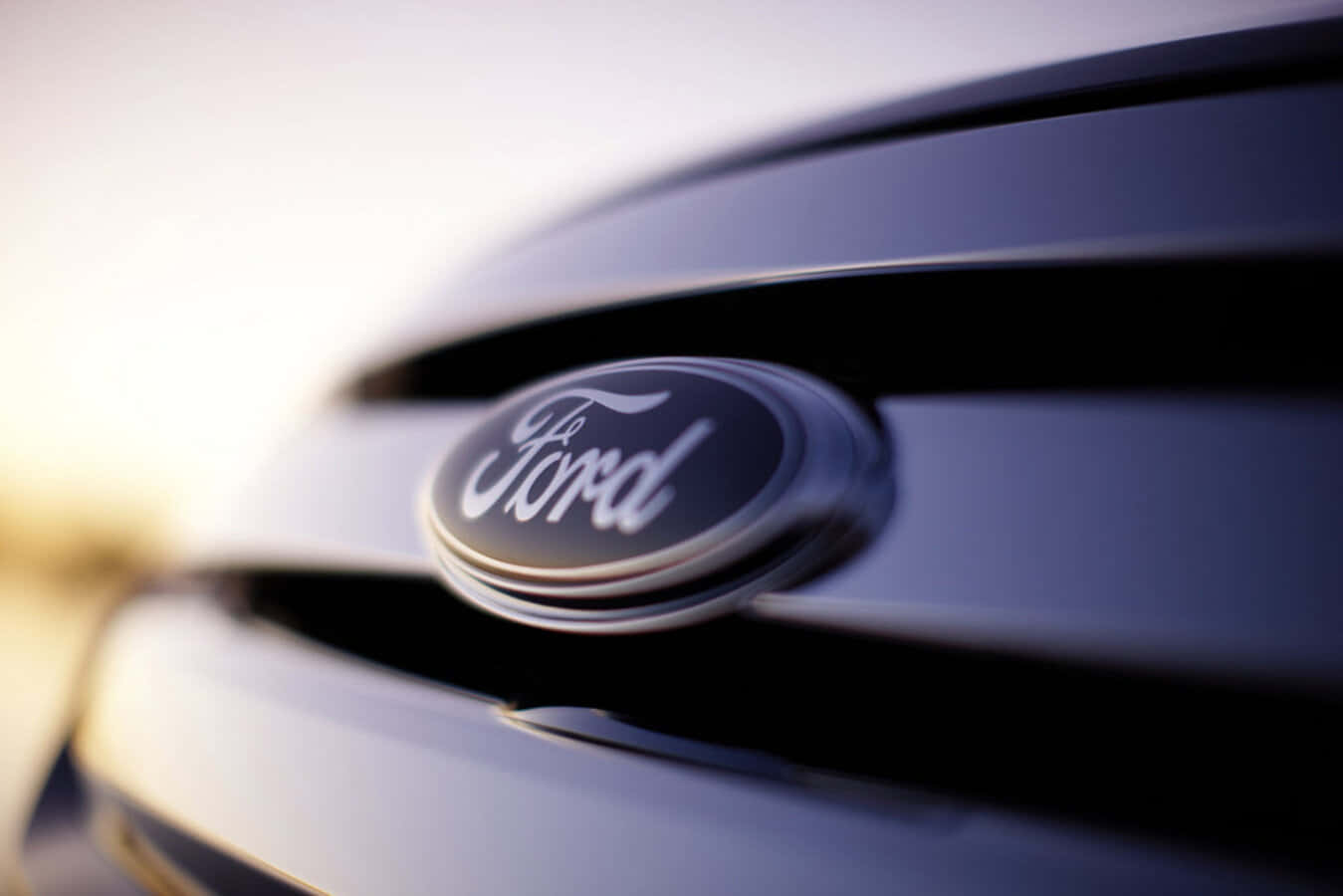 Ford logo, sleek dark car grille, soft golden backlighting, HD Desktop Wallpaper