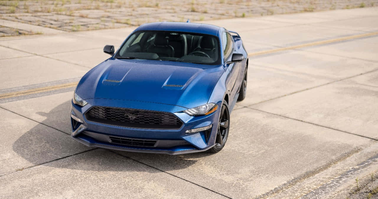 Ford Mustang California Special, vibrant blue, sunlit concrete lot, HD Desktop Wallpaper