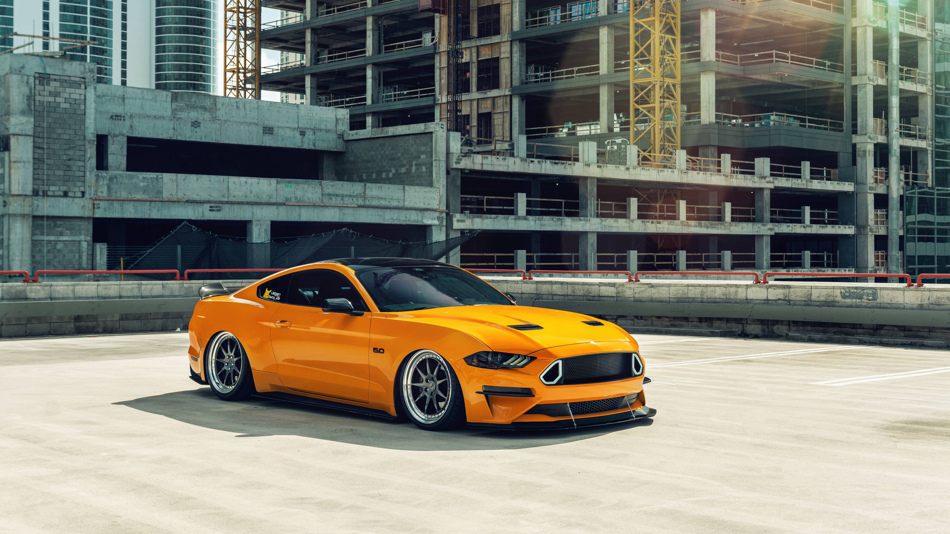 Ford Mustang, vibrant orange, concrete rooftop, 4K Desktop Wallpaper