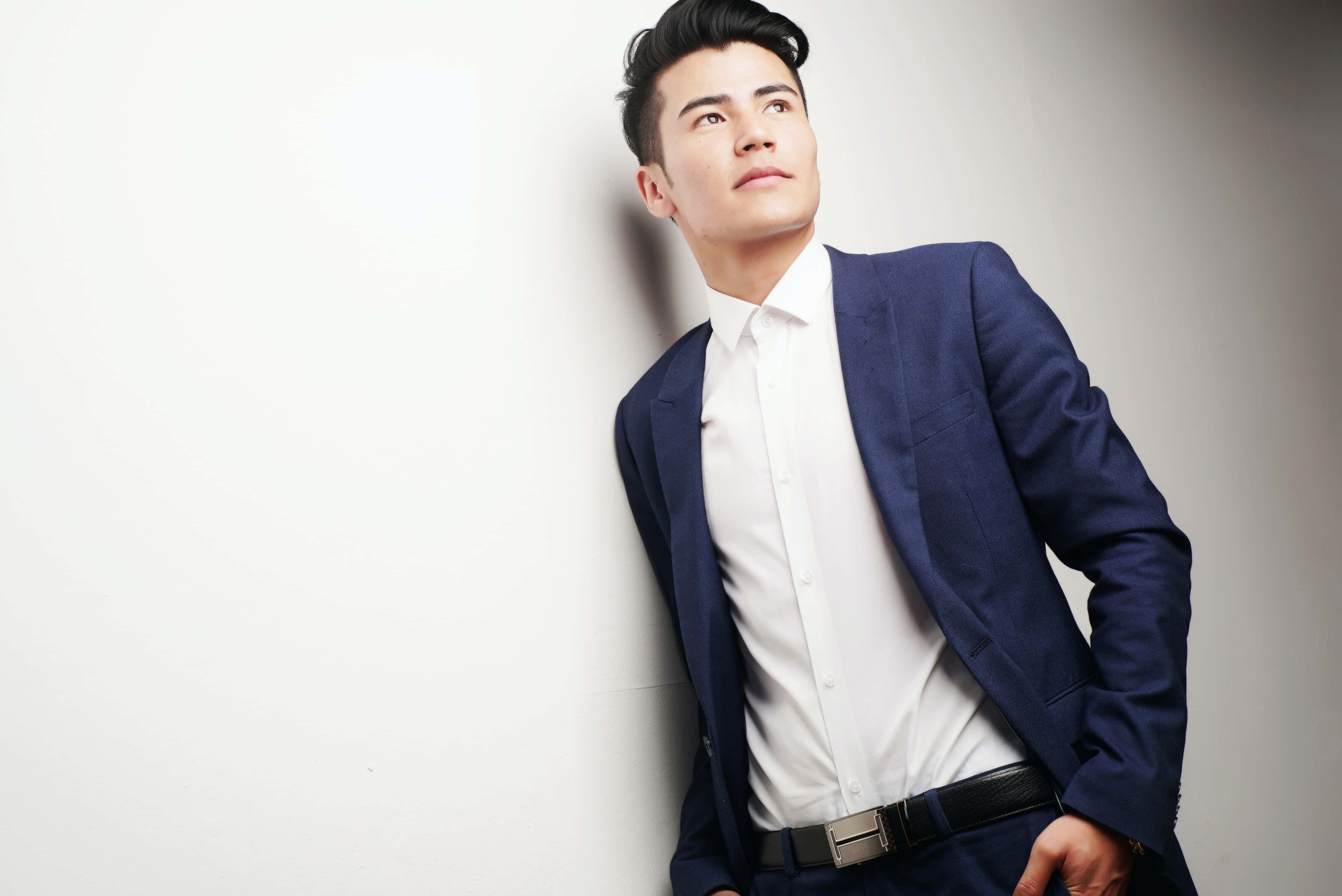 navy suit, man, plain wall, 4K Desktop Wallpaper