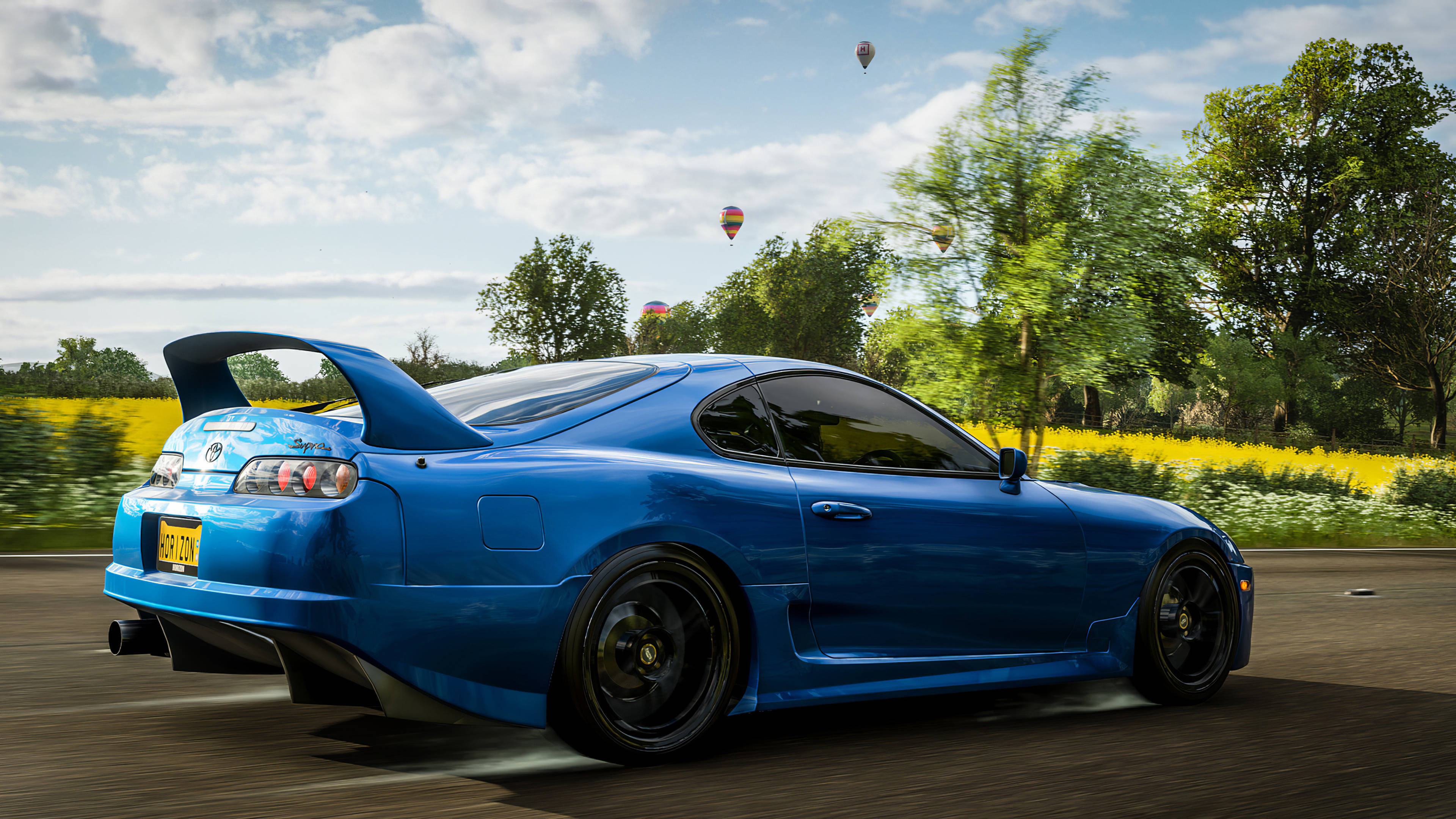 Forza 4, vibrant blue sports car, golden field, 4K Desktop Wallpaper