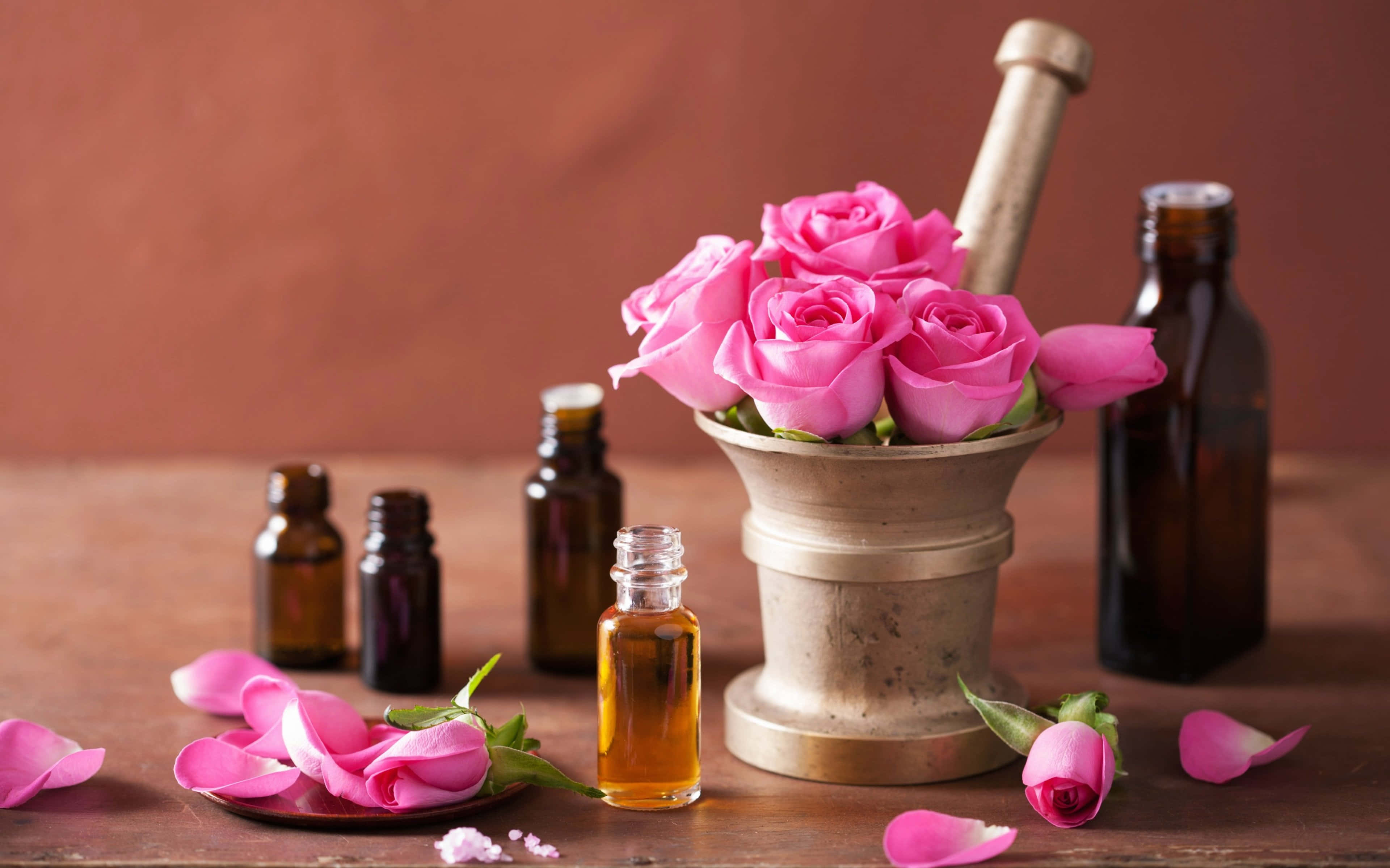 pink roses, brass mortar, amber bottles of essential oil, 4K Desktop Wallpaper