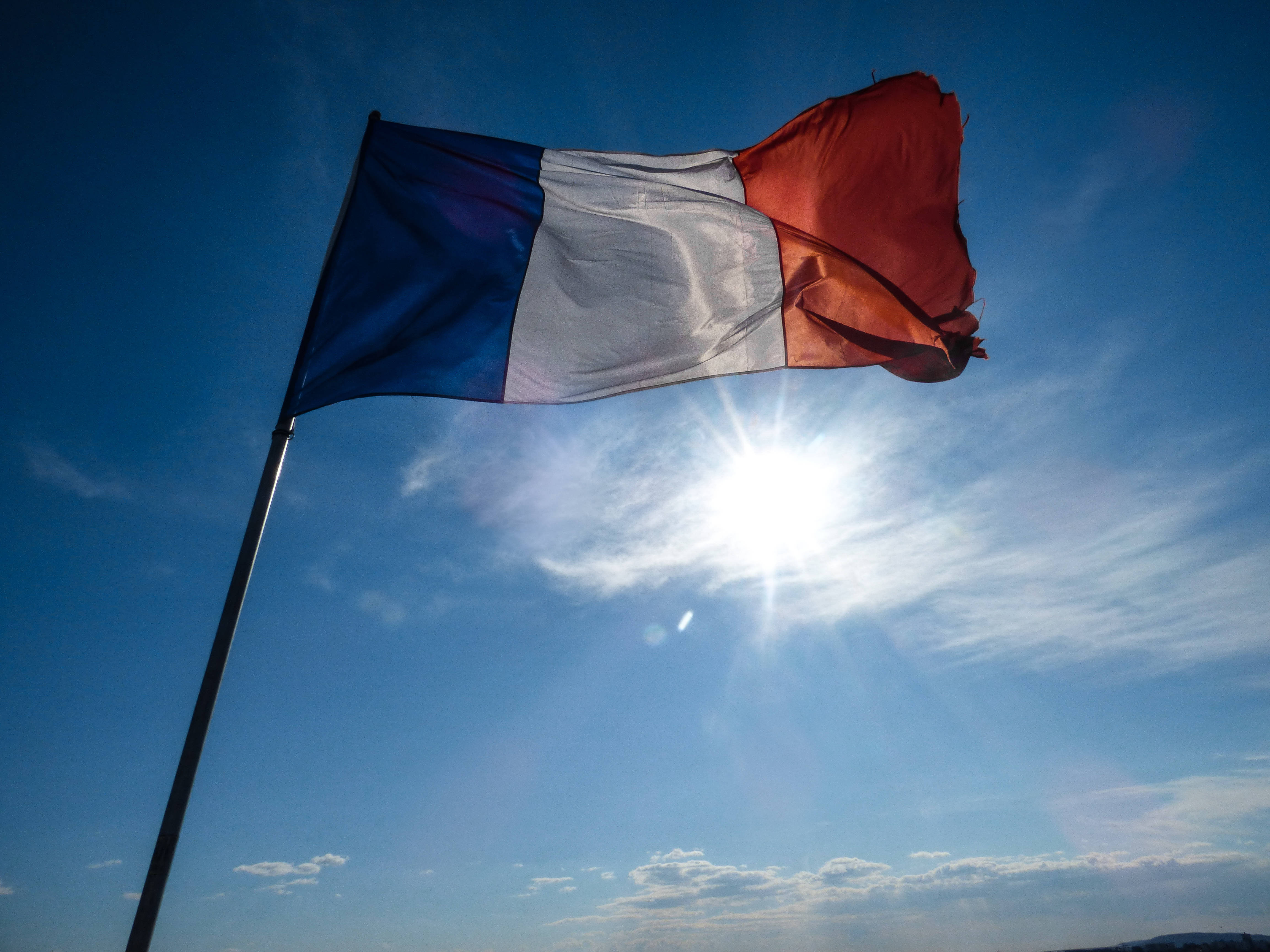 France flag, bright blue sky, sun, 4K Desktop Wallpaper
