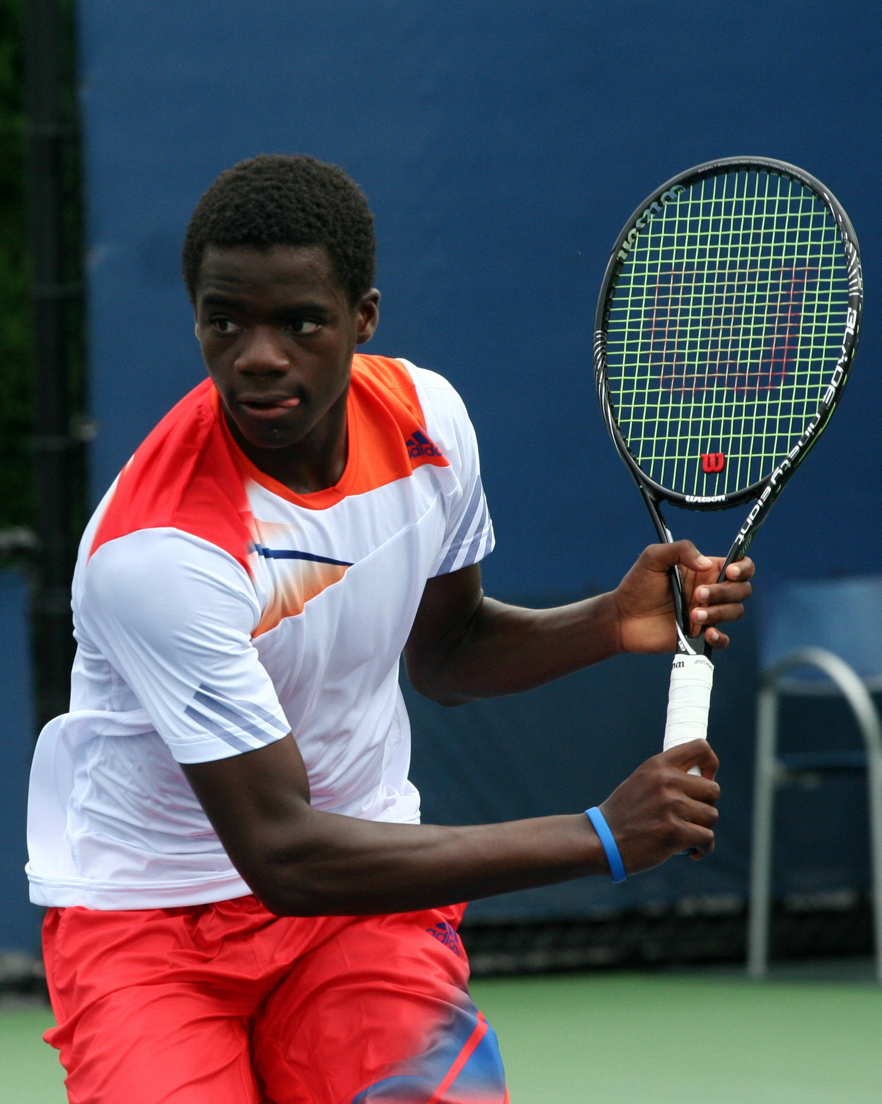 Frances Tiafoe, red and white gear, green court, Full HD Phone Wallpaper