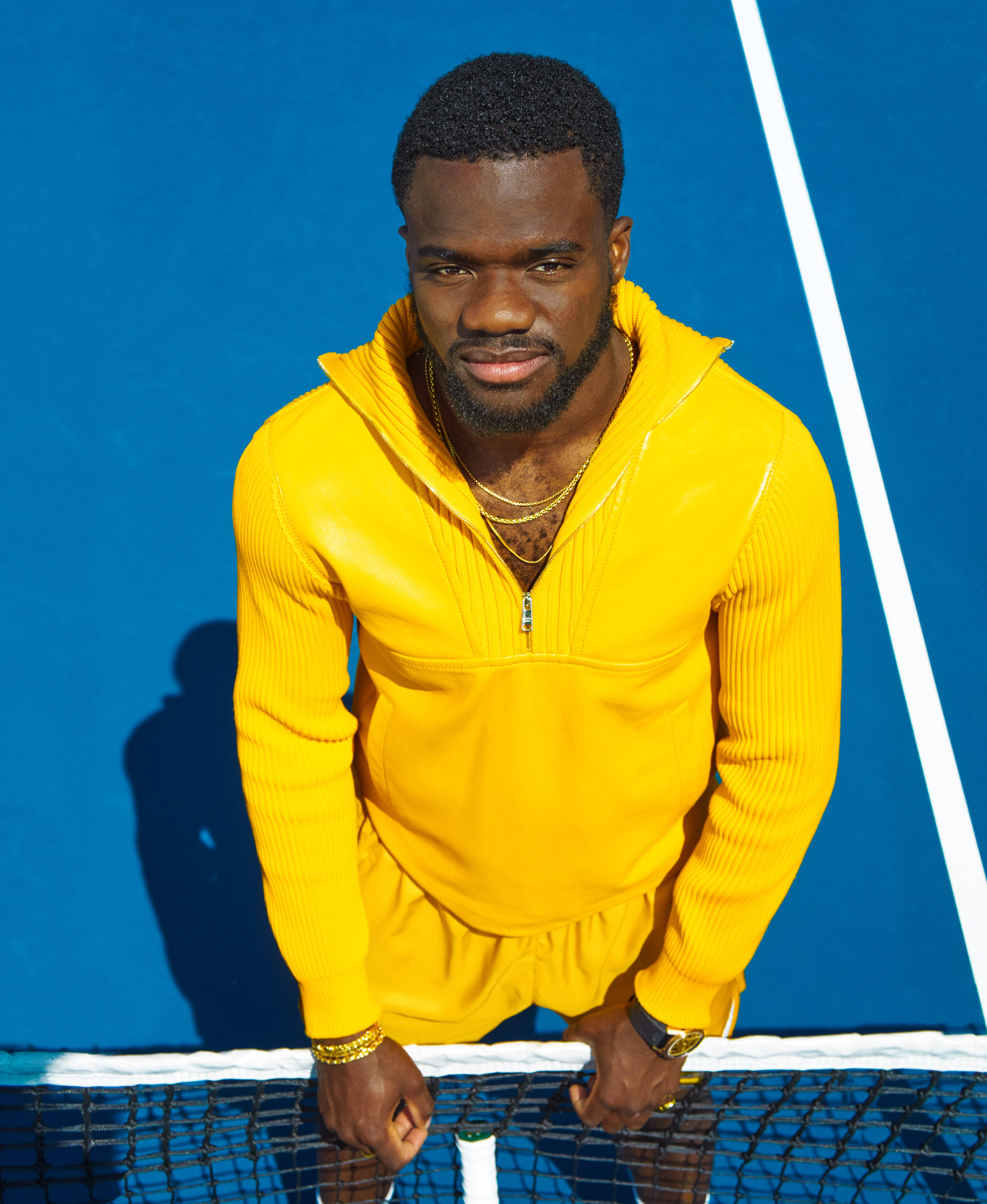 Frances Tiafoe, bright yellow ribbed hoodie, vivid blue court, 5K Phone Wallpaper