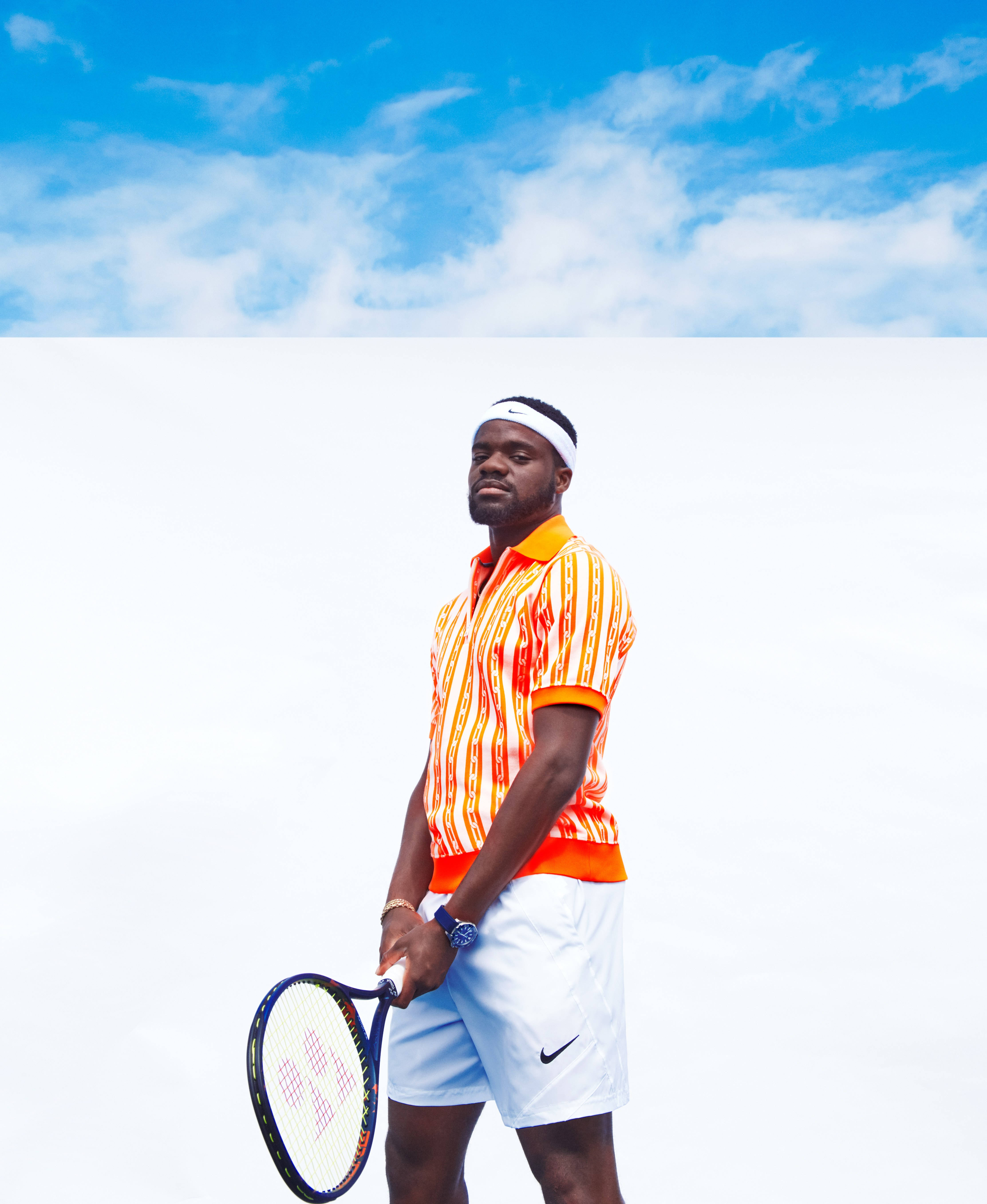Frances Tiafoe, vibrant orange striped shirt, white shorts, 5K Phone Wallpaper