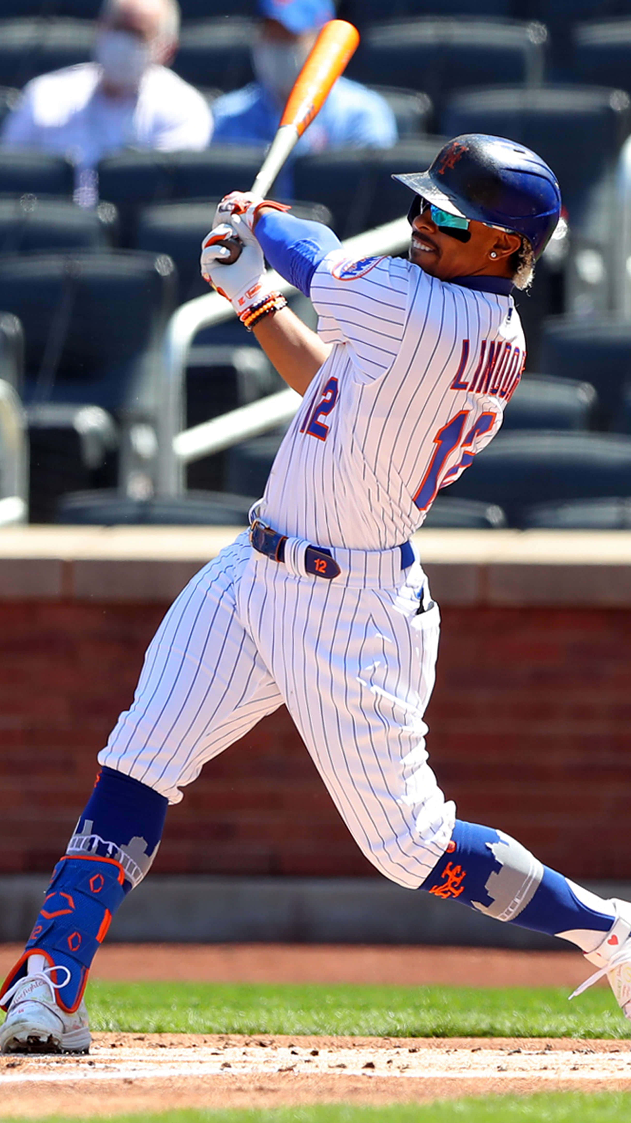 Francisco Lindor, white pinstripe uniform with blue accents, bat mid-swing, 4K Phone Wallpaper