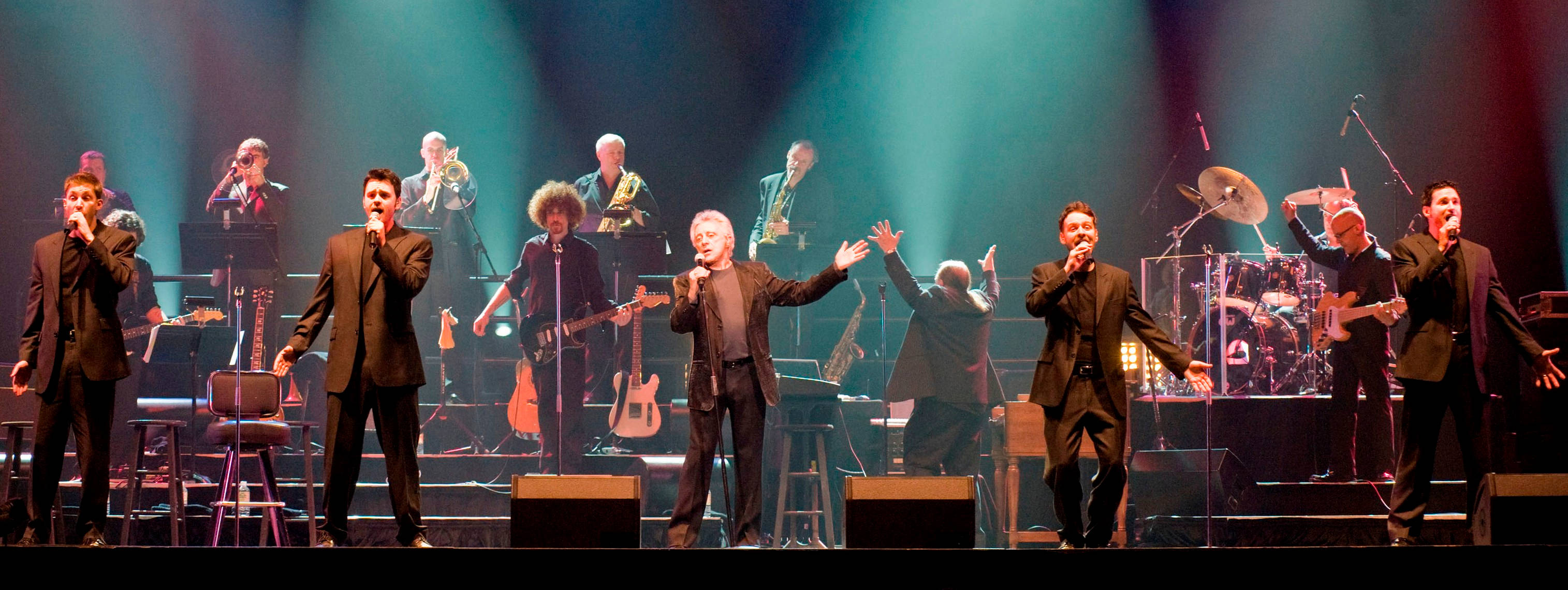 Frankie Valli And The Four Seasons, green and blue spotlights, dimly lit stage, 2K Desktop Wallpaper