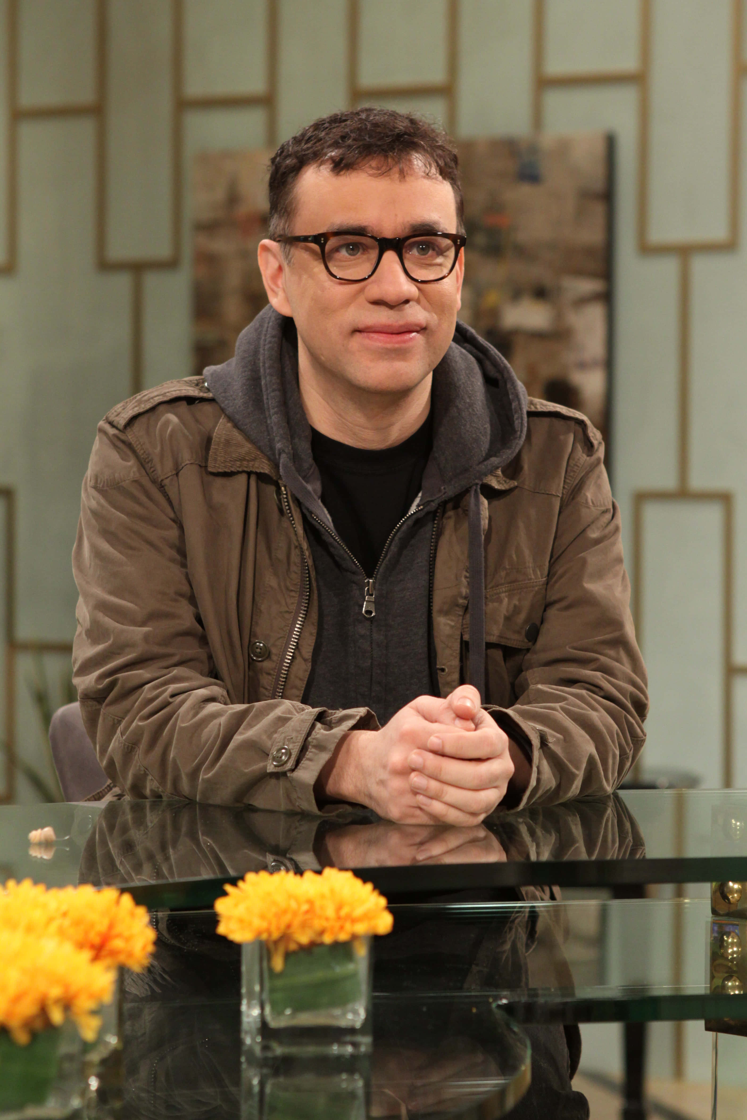 Fred Armisen, glass table, orange flowers, 4K Phone Wallpaper