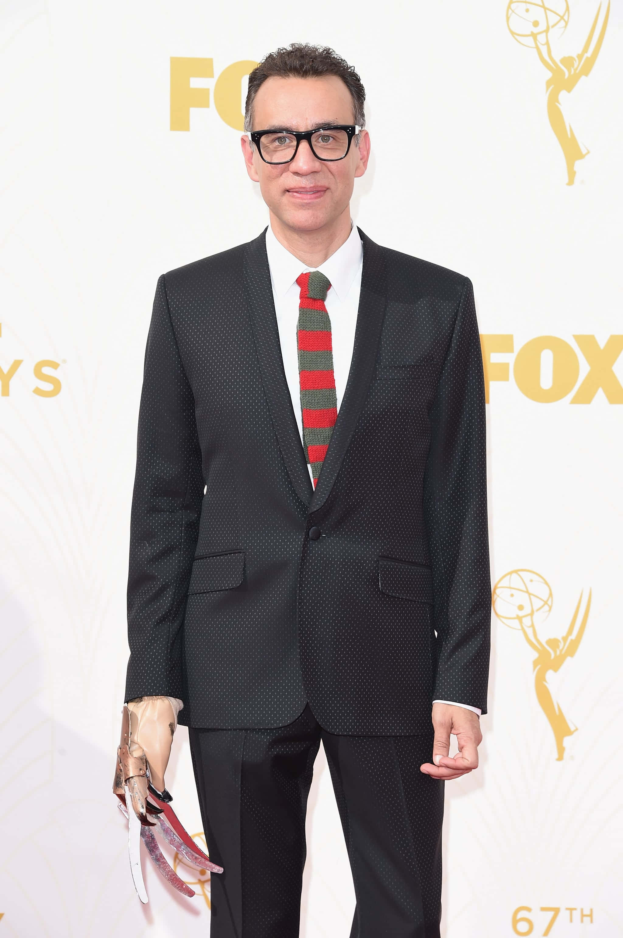 Fred Armisen, black textured suit, red green striped tie, 2K Phone Wallpaper