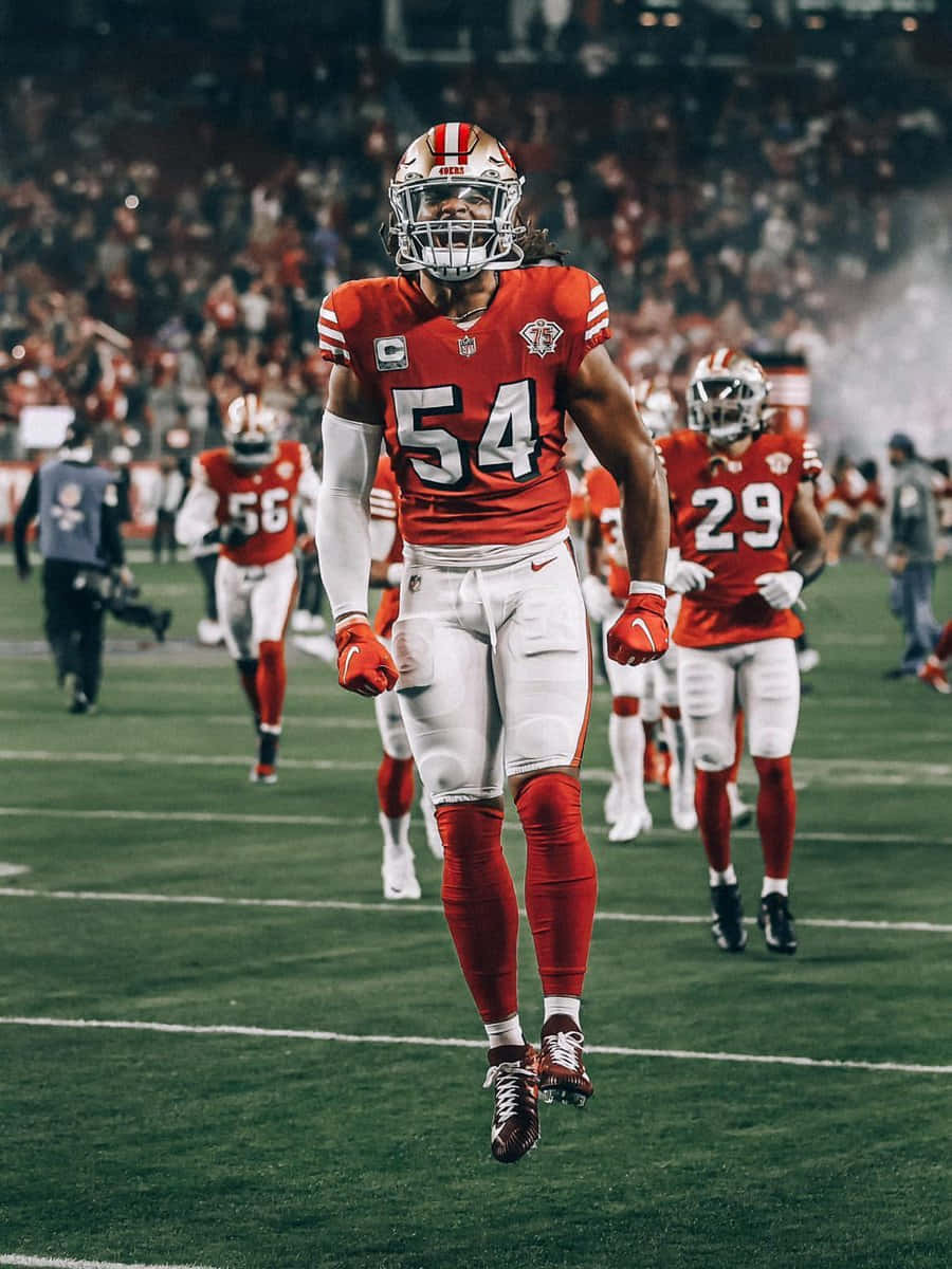 Fred Warner, red and white uniform, lit field, SD Phone Wallpaper