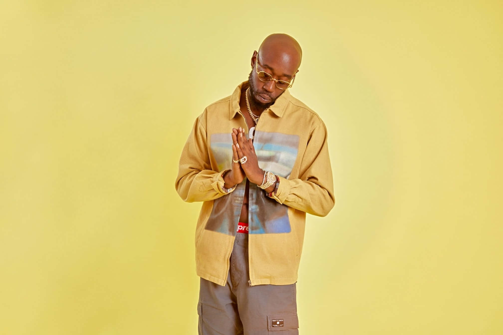 Freddie Gibbs, gold-rimmed glasses, tan Supreme jacket, Full HD Desktop Wallpaper
