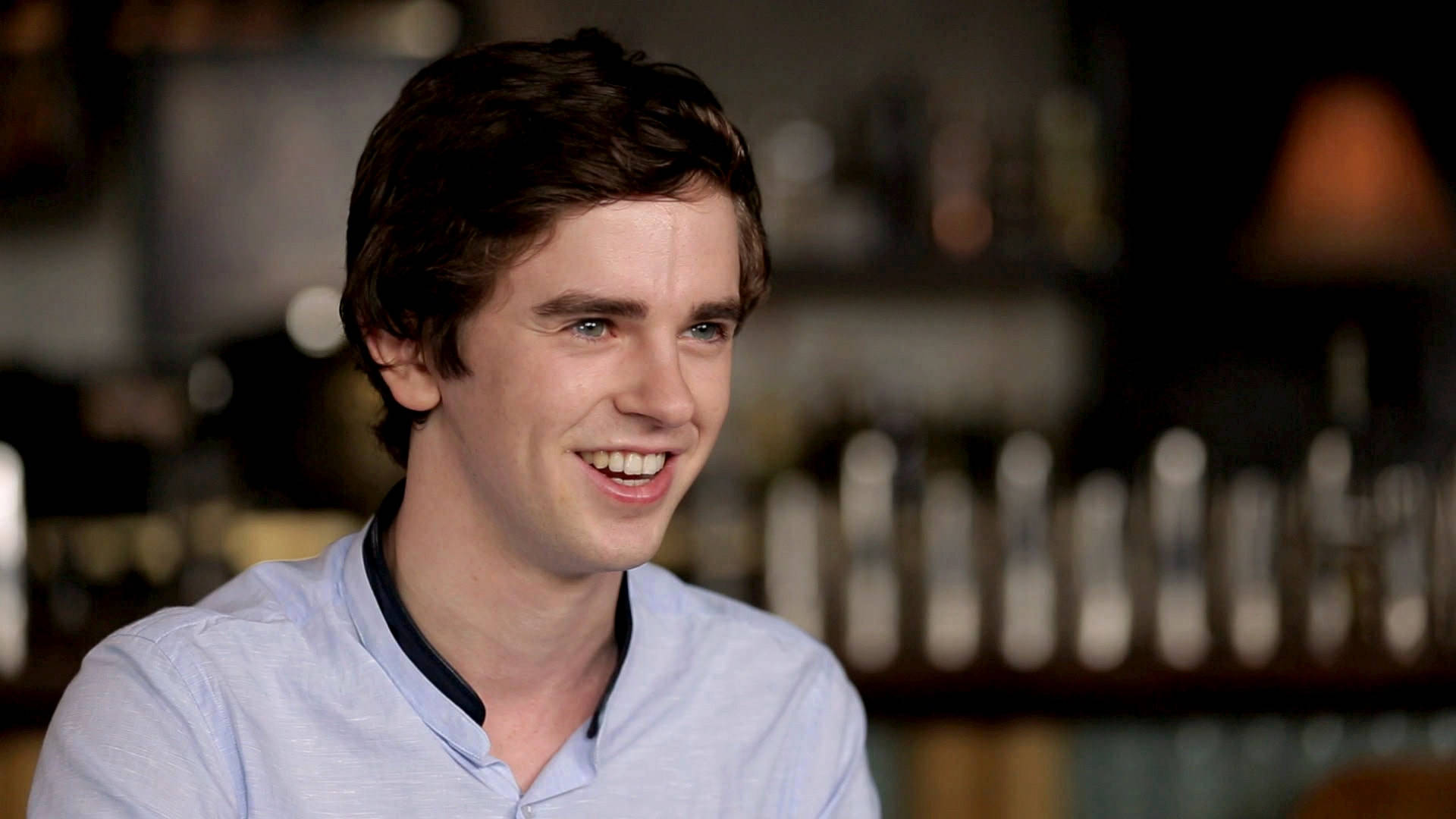 Freddie Highmore, brown hair, softly lit bar, Full HD Desktop Wallpaper