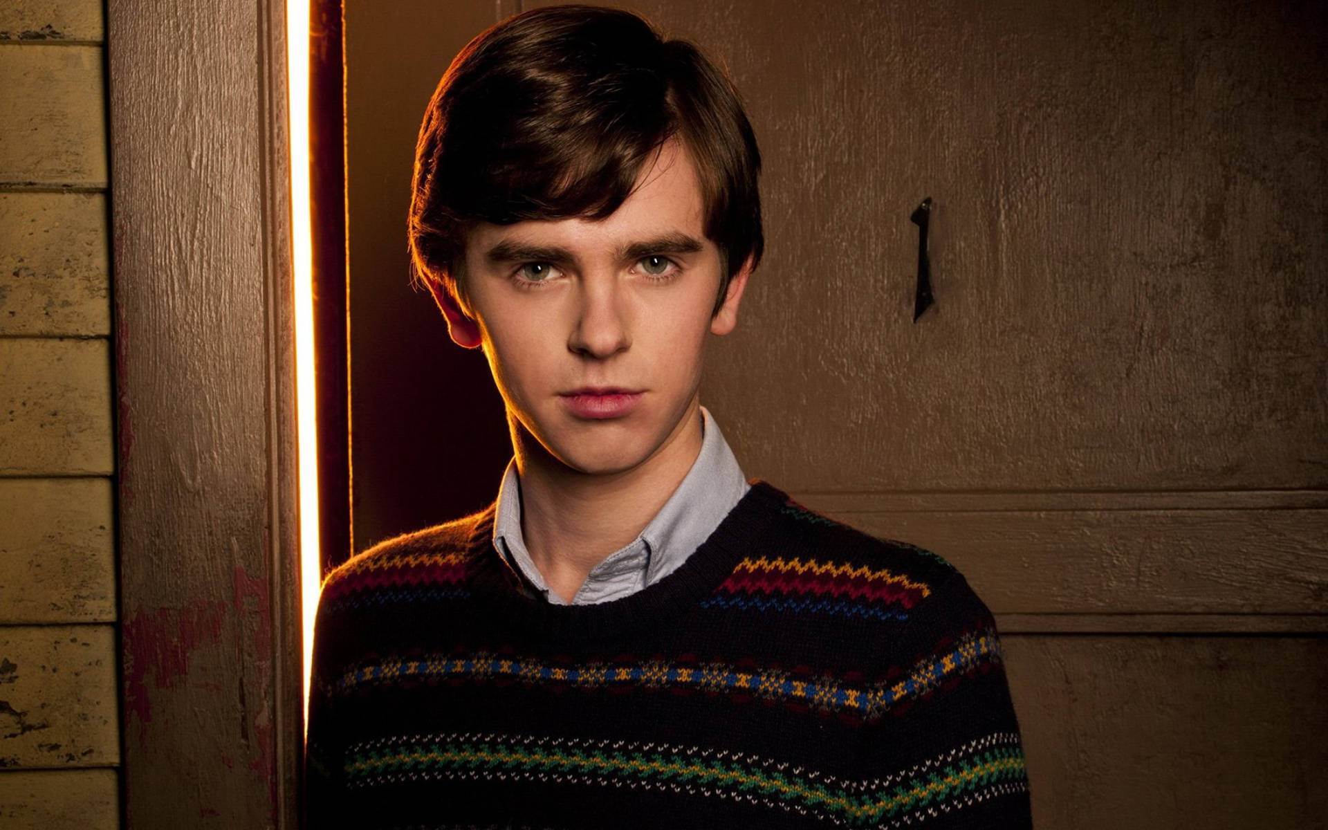 Freddie Highmore, colorful patterned sweater, doorway, Full HD Desktop Wallpaper