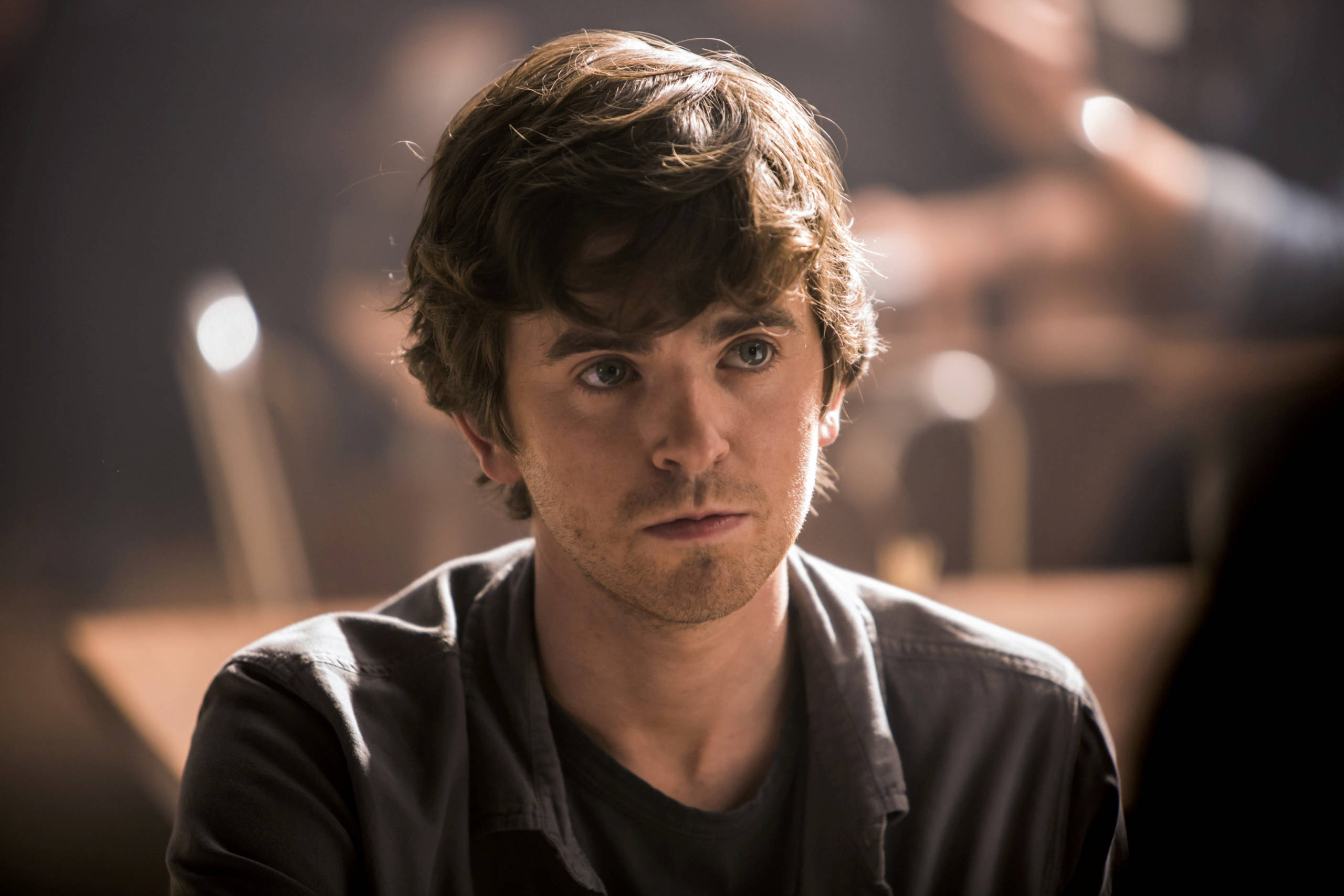 Freddie Highmore, tousled brown hair, intense gaze, 2K Desktop Wallpaper