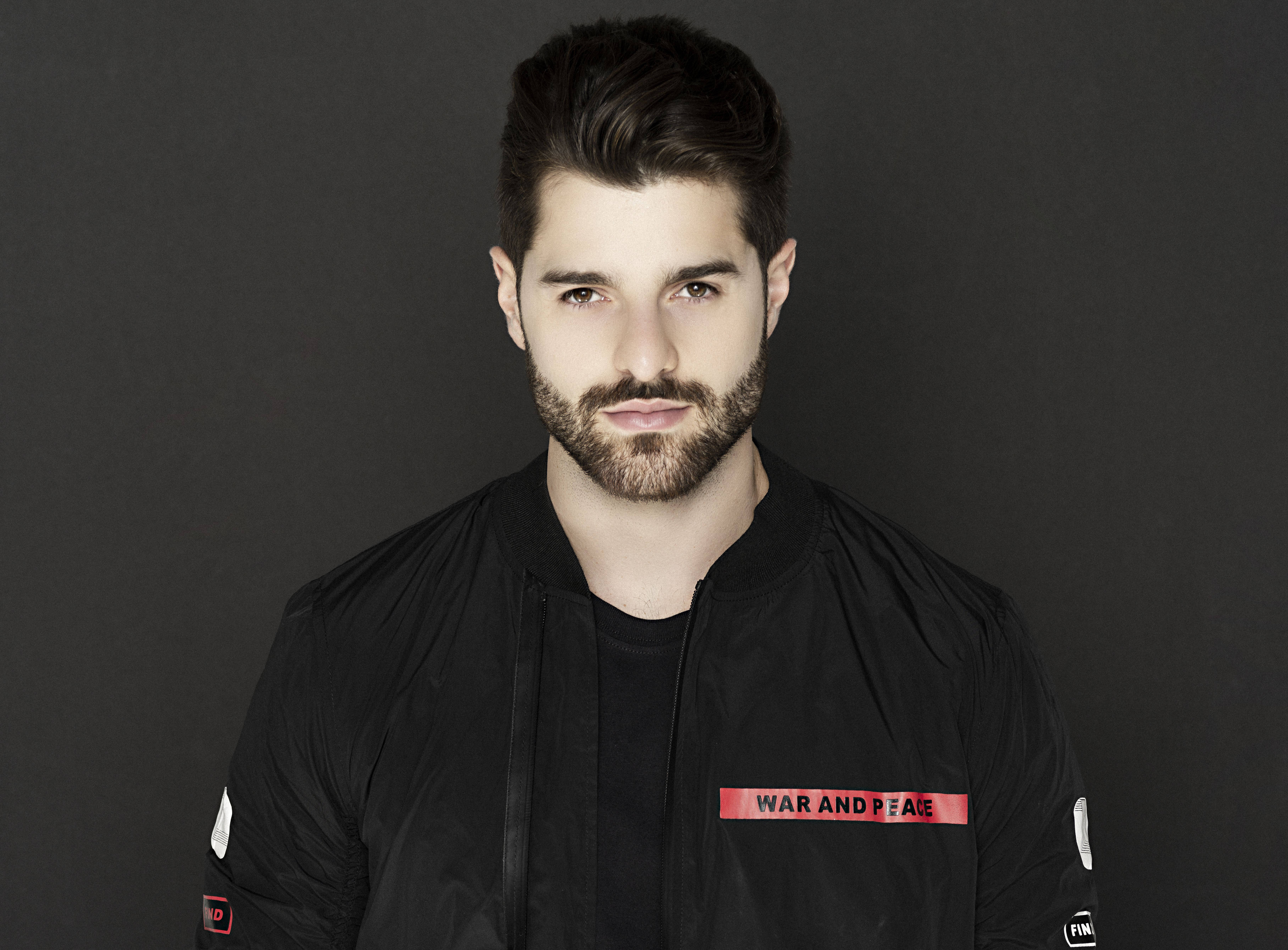 Free Fire Alok, black bomber jacket, red 'WAR AND PEACE' text, 5K Desktop Wallpaper