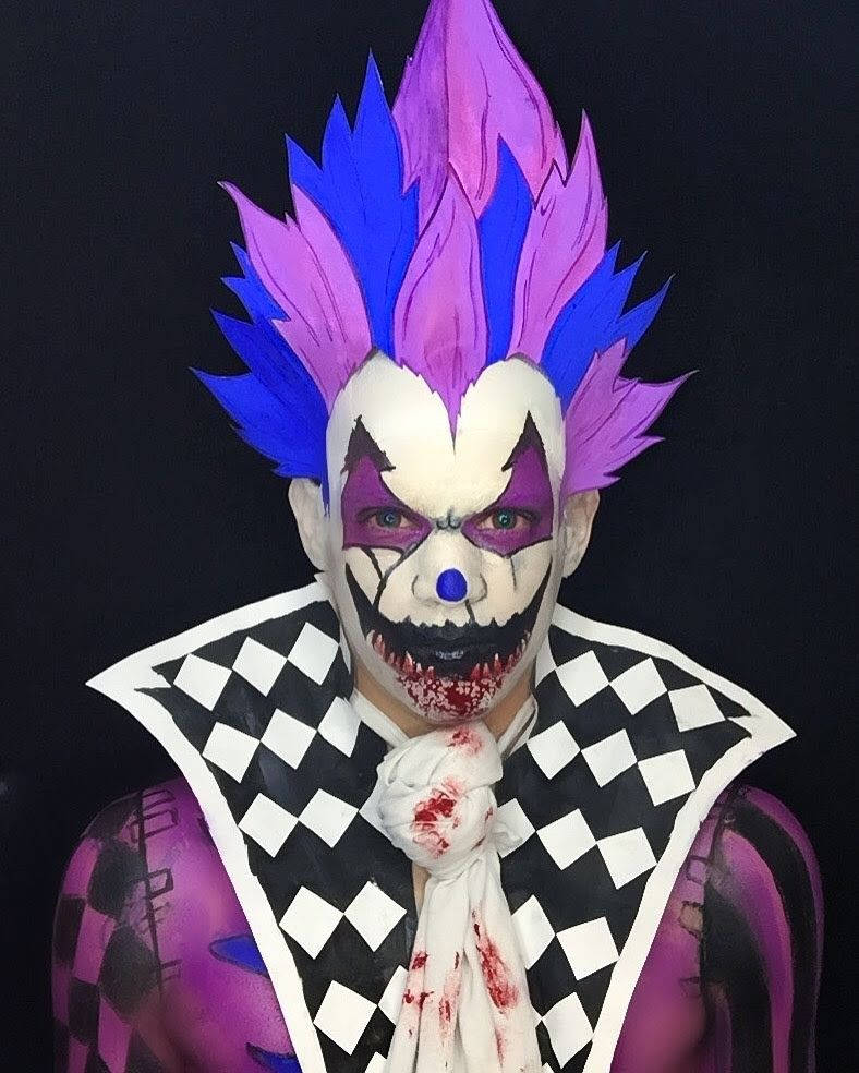 Free Fire Joker, spiky blue and purple hair, bloodstained checkered collar, SD Phone Wallpaper