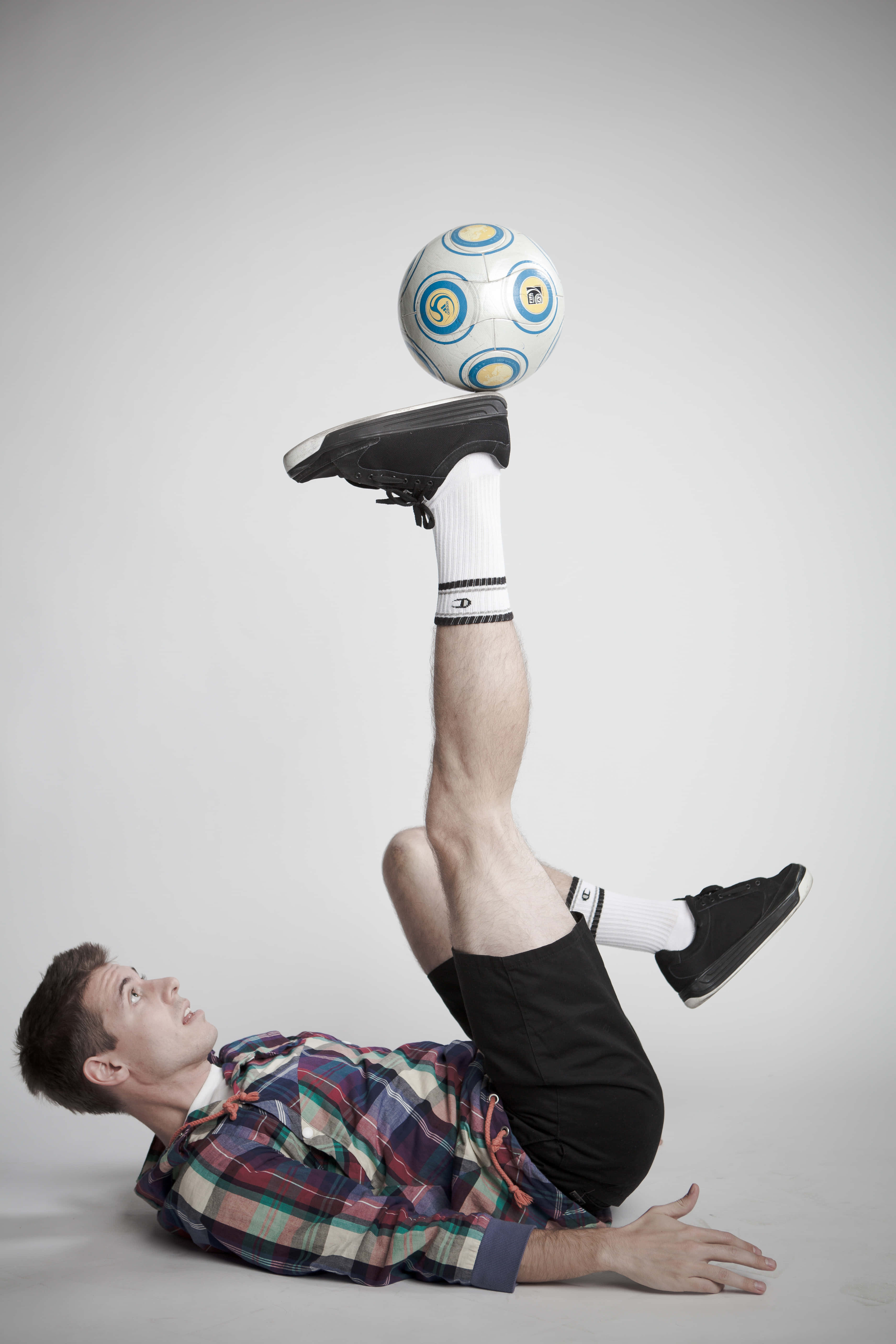plaid shirt, soccer ball, raised foot, 5K Phone Wallpaper