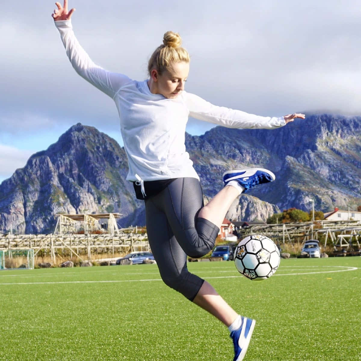 Freestyle Soccer, vibrant green field, dramatic mountains, SD Desktop Wallpaper