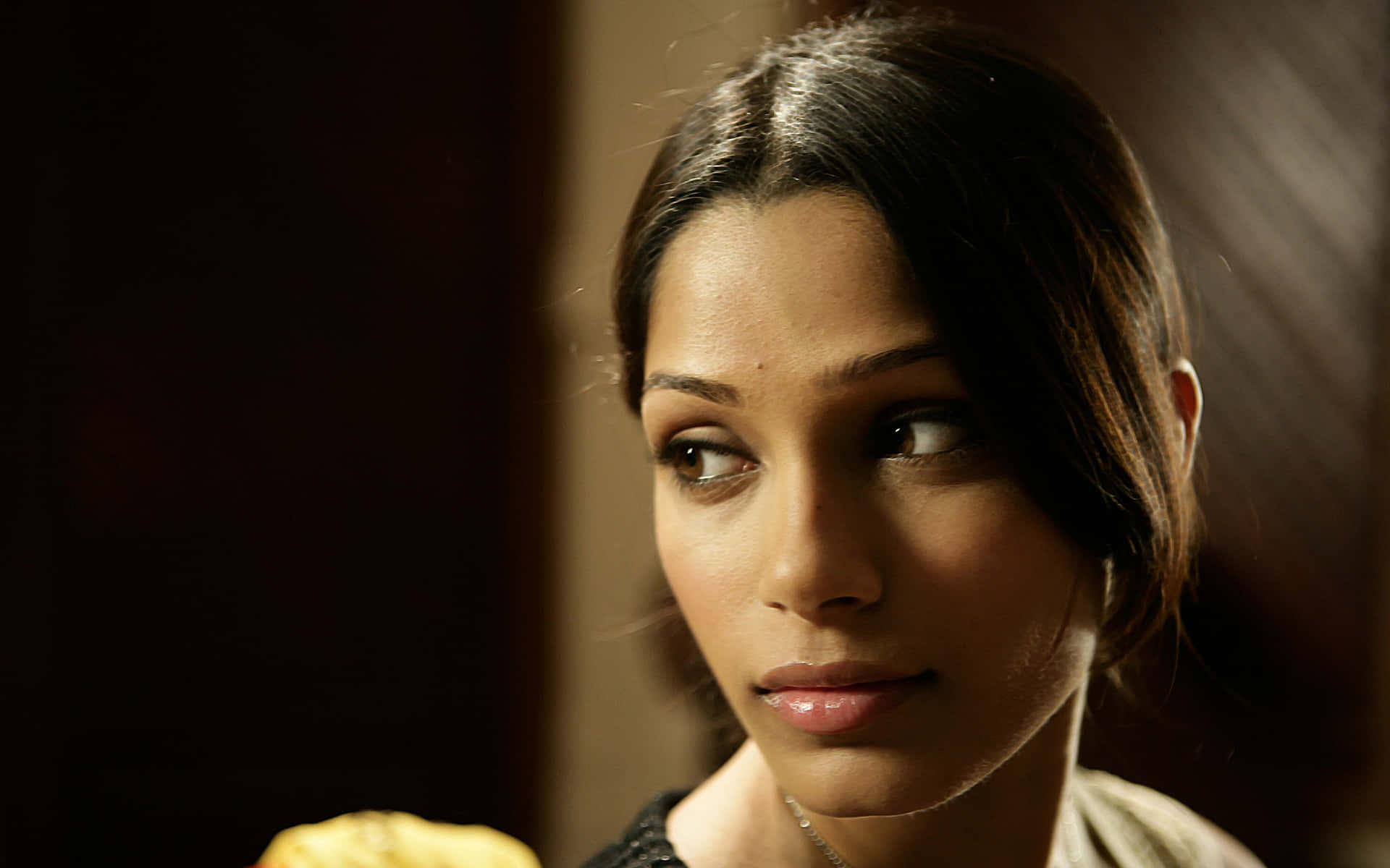 Freida Pinto, black outfit, warmly lit indoor setting, Full HD Desktop Wallpaper