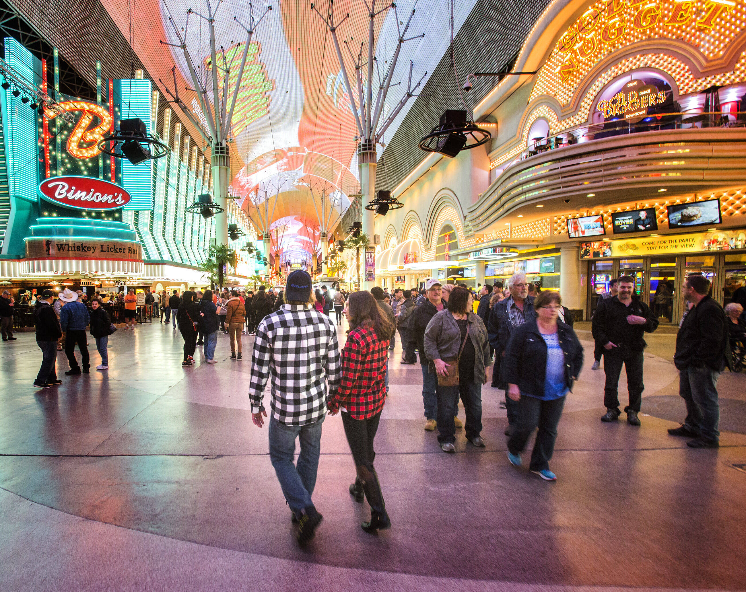 Fremont Street, neon-lit casino corridor, glowing signs, 2K Desktop Wallpaper