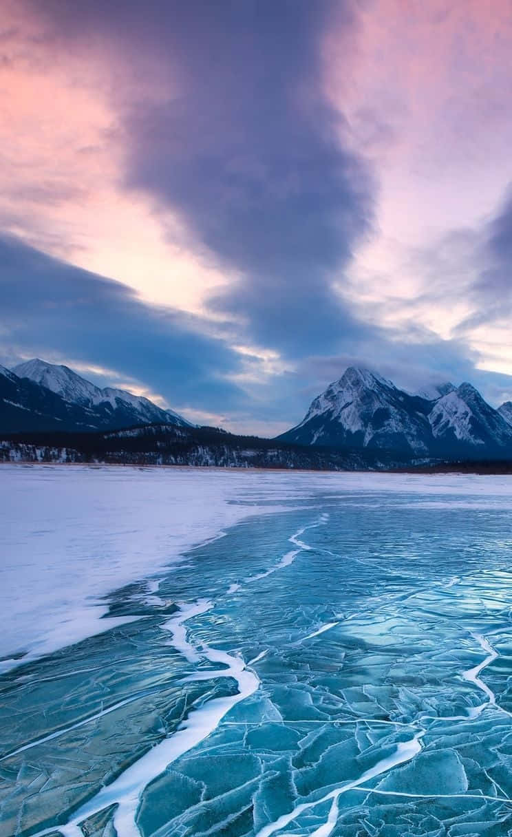 Frozen Lake, cracked turquoise ice, snowy shore, SD Phone Wallpaper