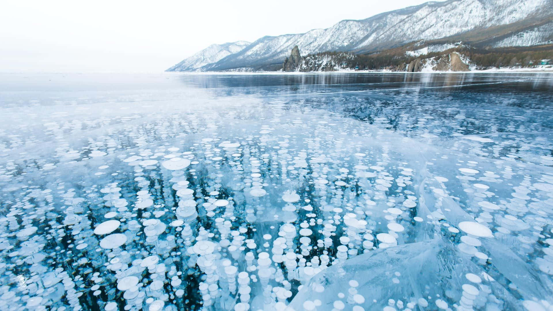 Frozen Lake, bubble formations, snow-capped mountains, Full HD Desktop Wallpaper