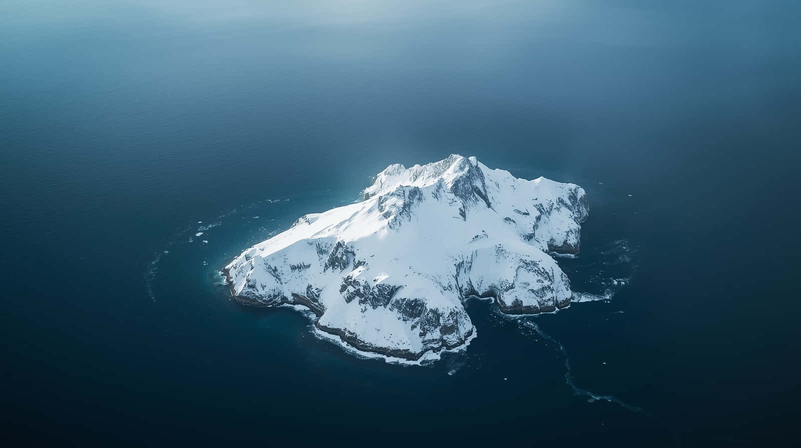 snowcapped mountain island, deep blue ocean waters, aerial view, HD Desktop Wallpaper