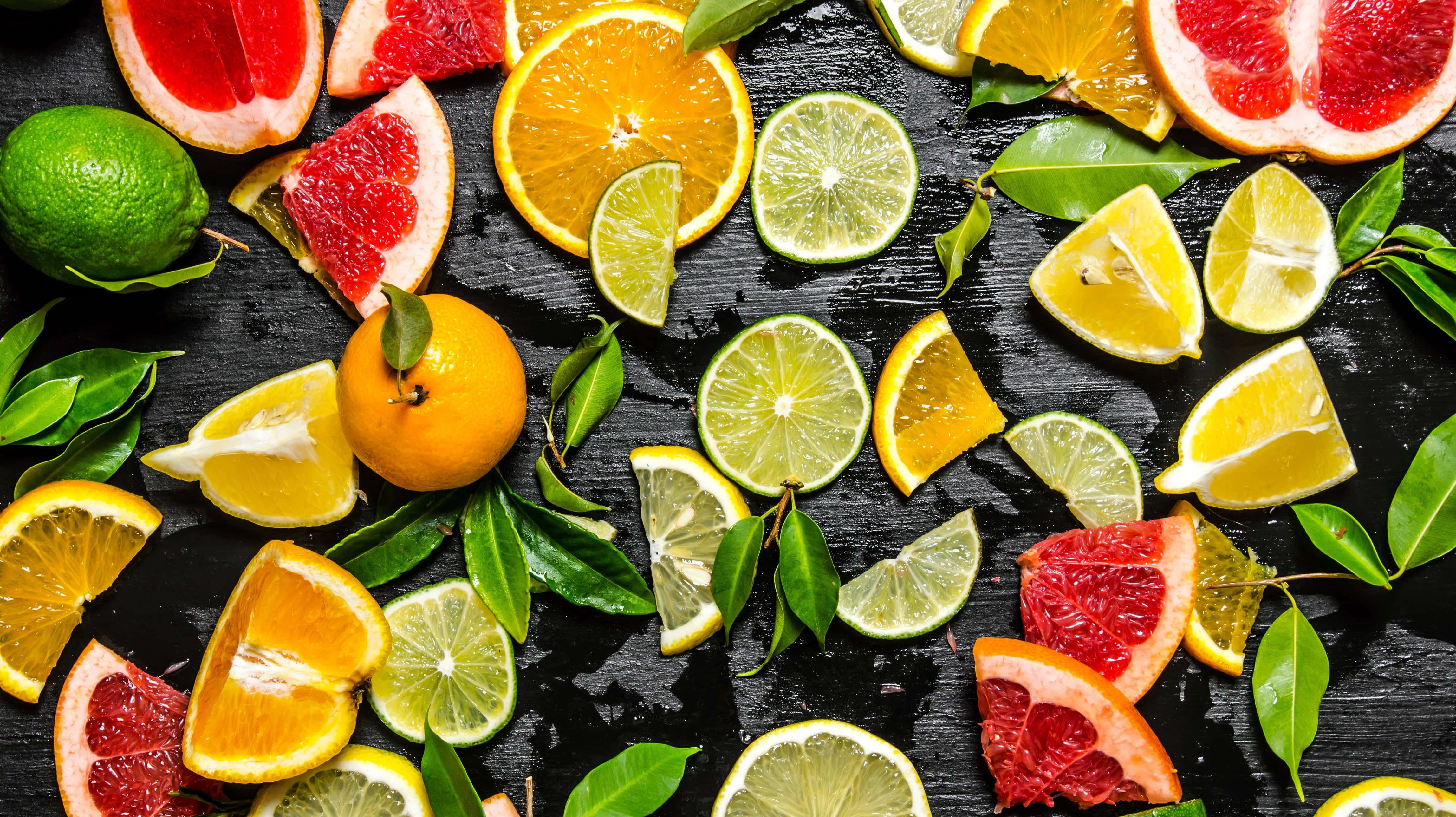 assorted citrus fruits, dark background, wet surface, 4K Desktop Wallpaper