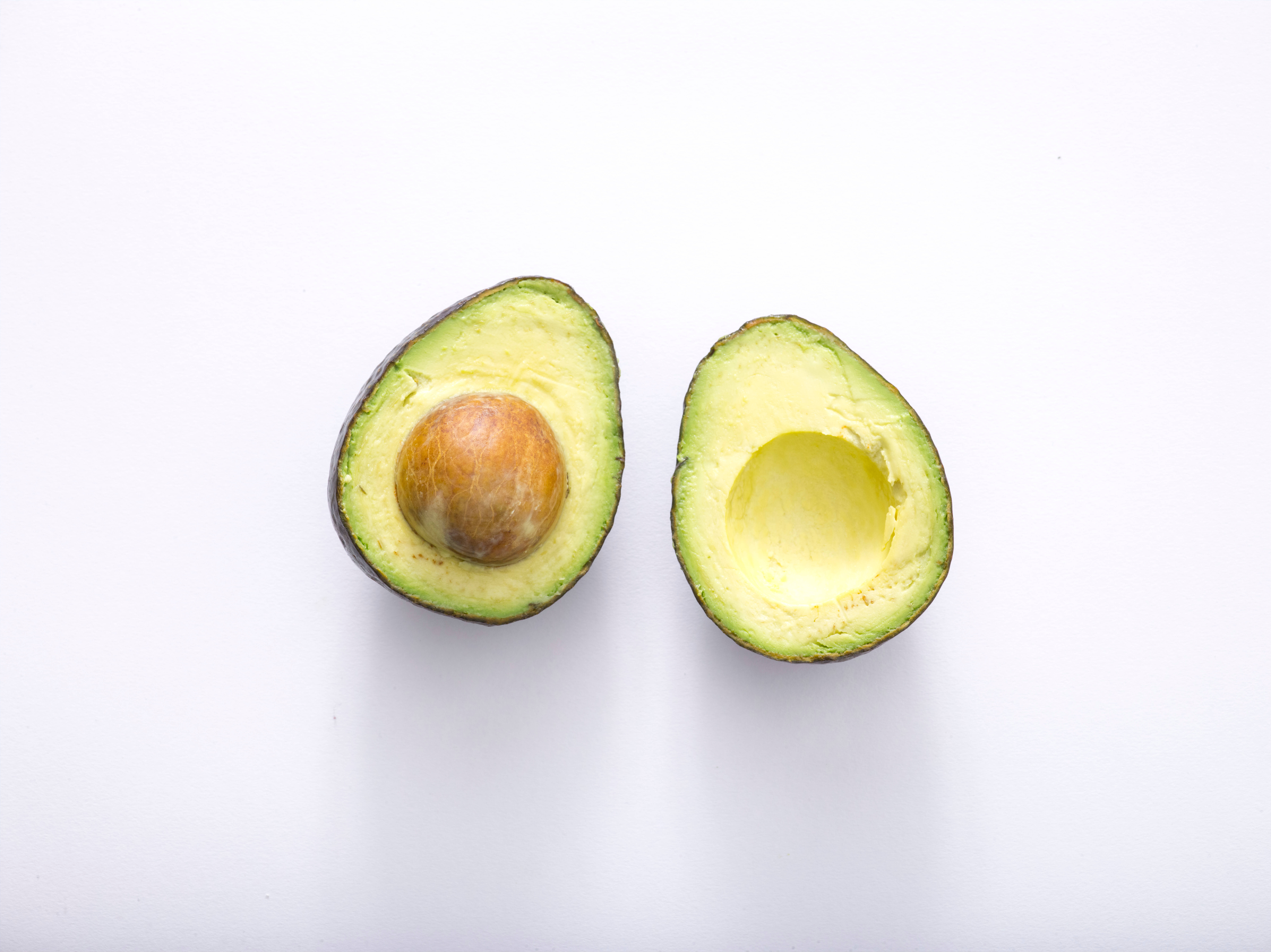 pastel green avocado fruit, ripe avocado, creamy green flesh, 8K Desktop Wallpaper