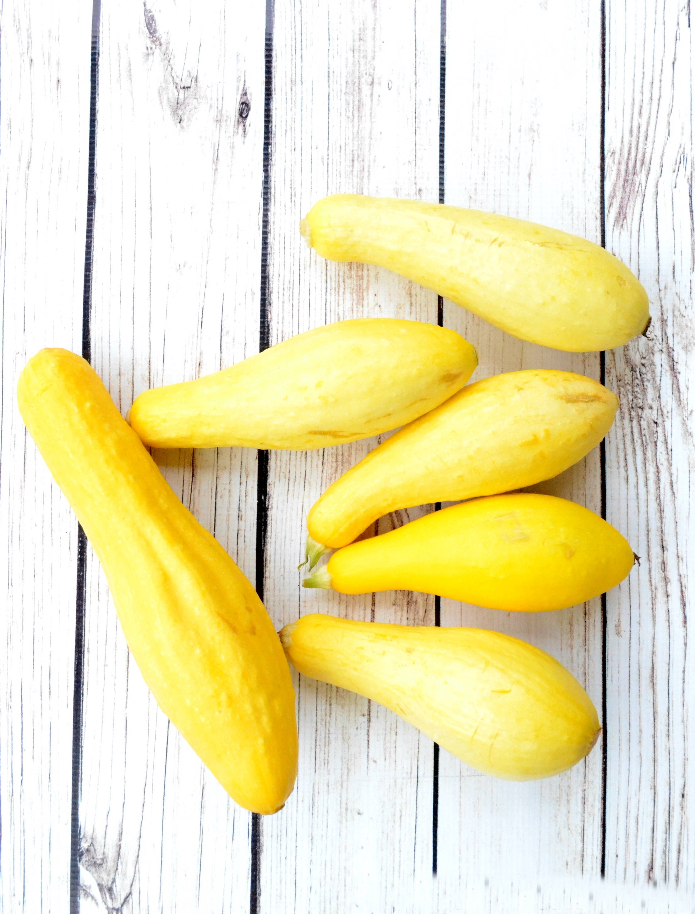 yellow squash, white wood surface, summer squash, 2K Phone Wallpaper