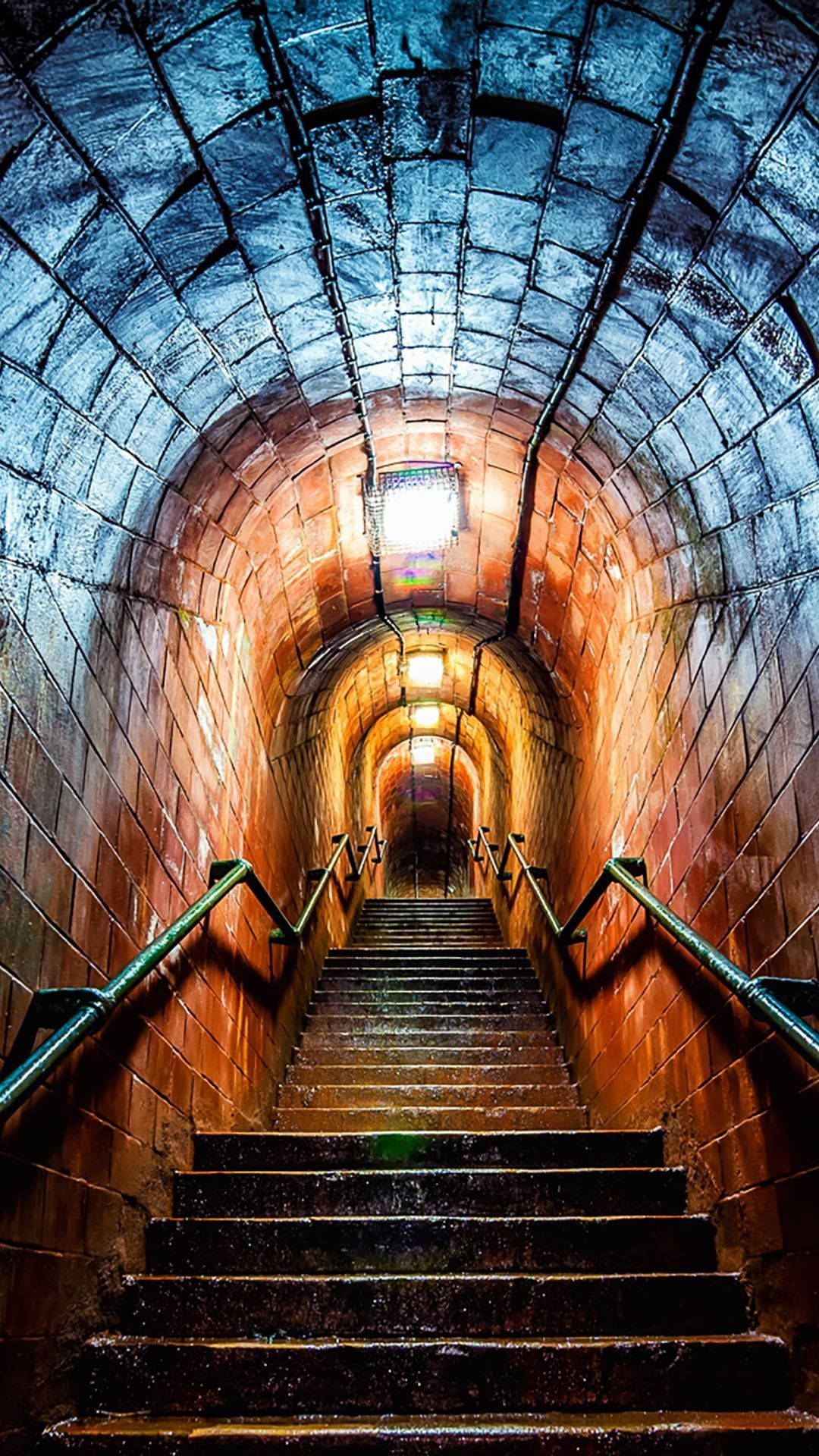 underground stairs, wet stone staircase, dimly lit arched tunnel, Full HD Phone Wallpaper
