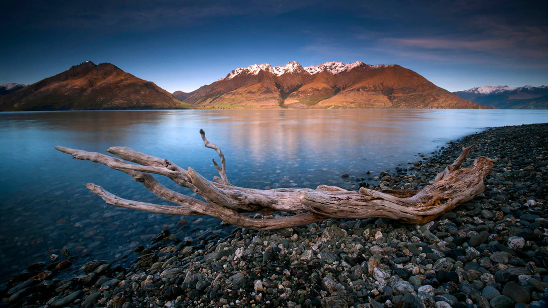driftwood log, pebbled shore, calm lake, Full HD Desktop Wallpaper