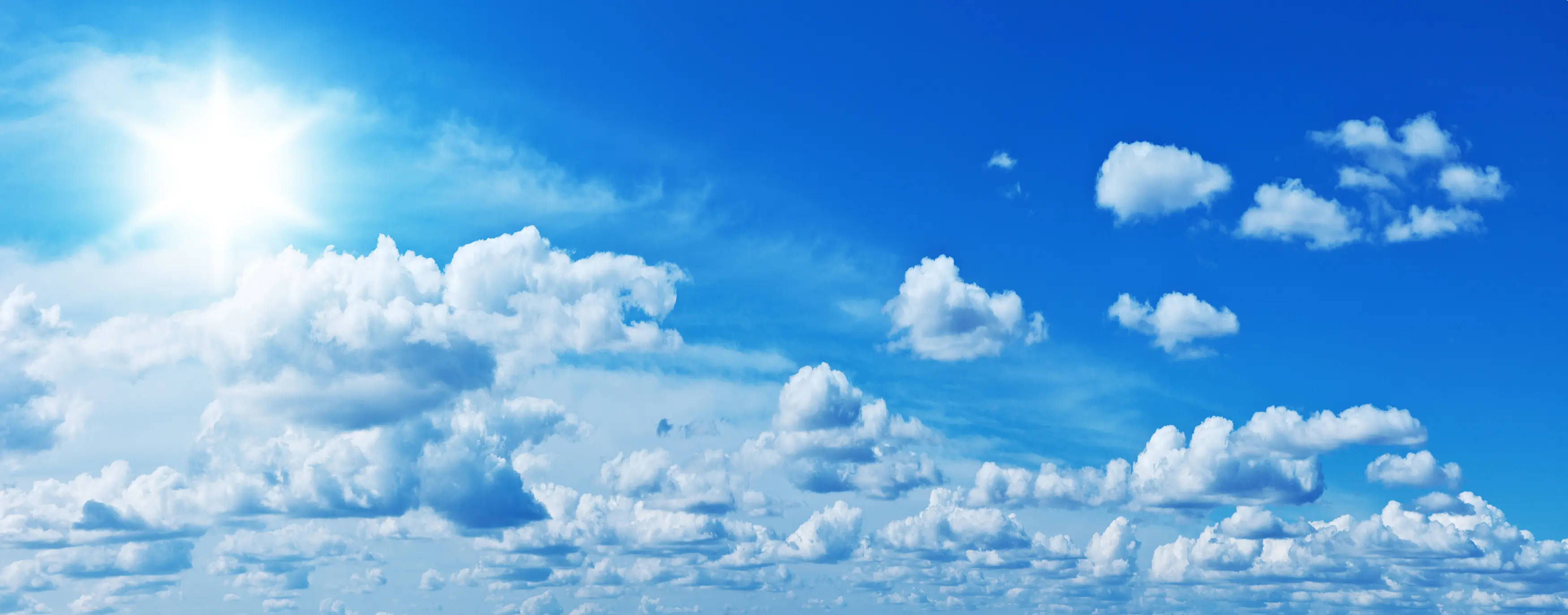 calming blue funeral clouds, bright sun, vast blue sky, 2K Desktop Wallpaper