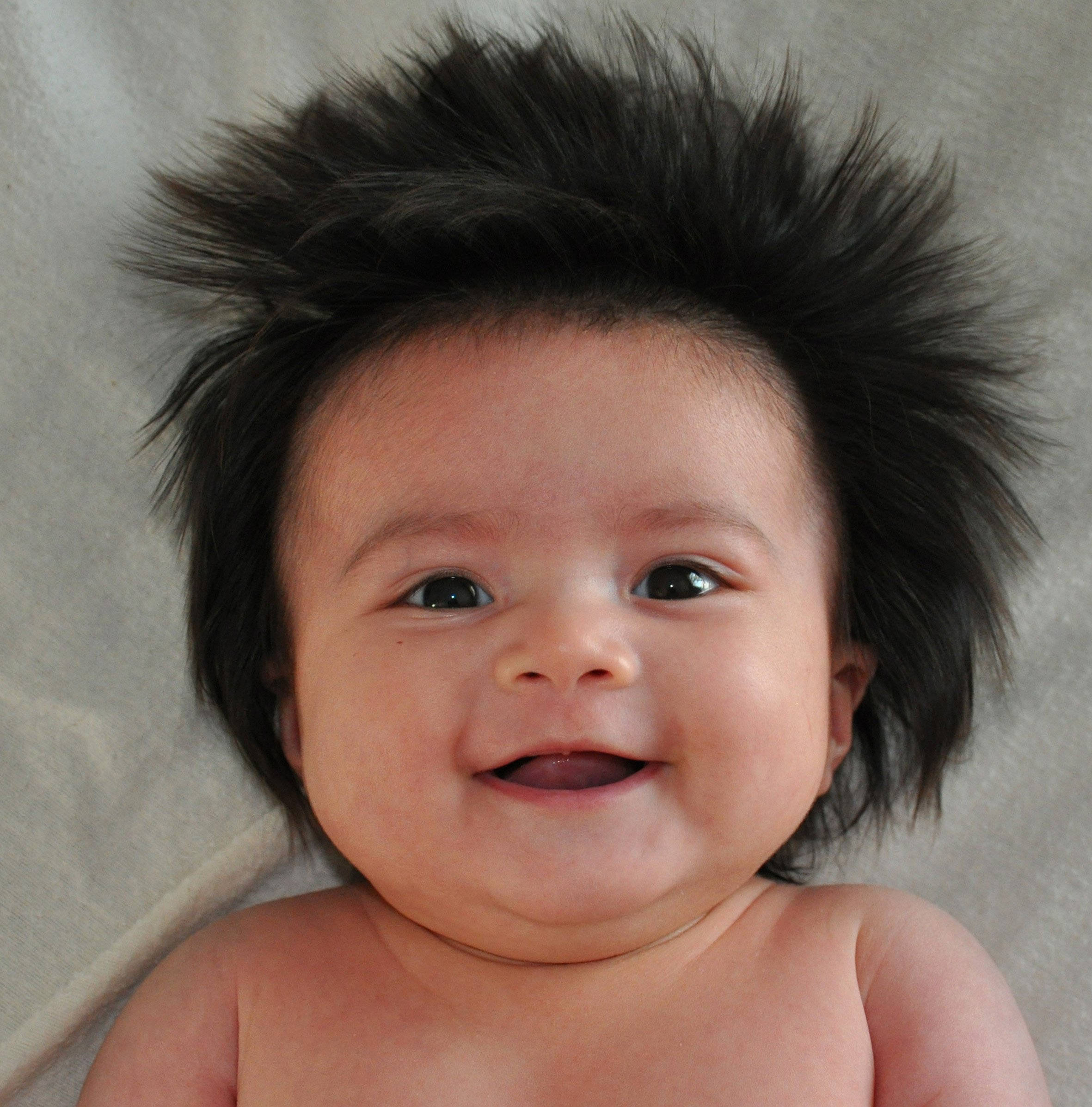 hairy funny baby, wild spiky black hair, soft gray fabric background, Full HD Phone Wallpaper