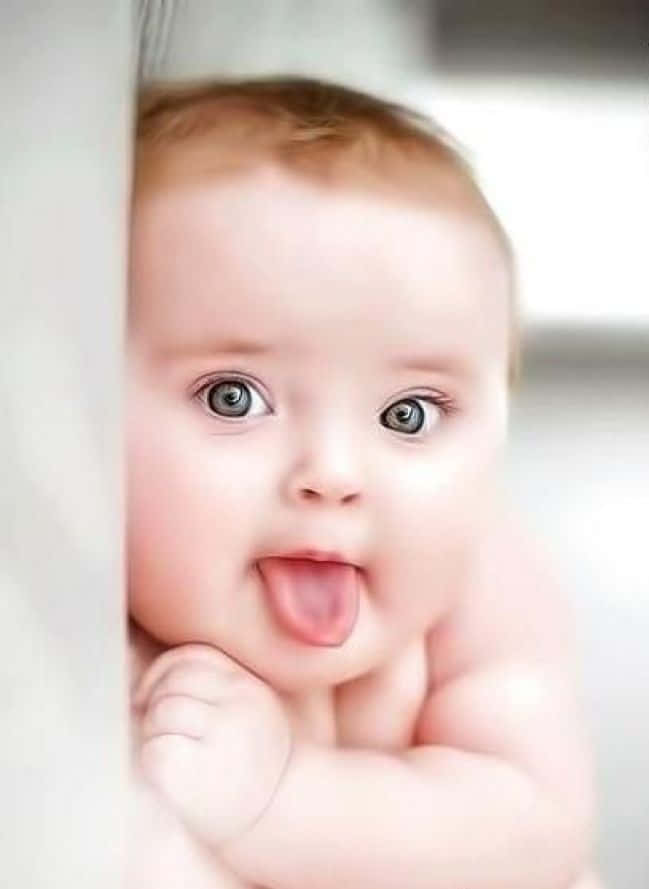 baby, tongue out, wide blue eyes, SD Phone Wallpaper