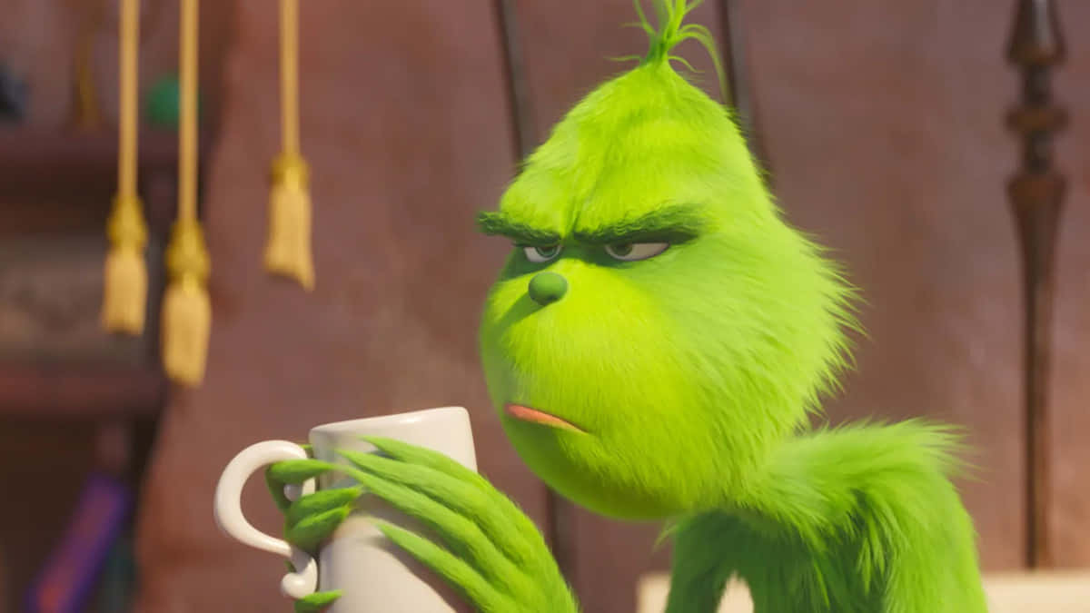 Grinch, steaming white mug, warmly lit room, SD Desktop Wallpaper
