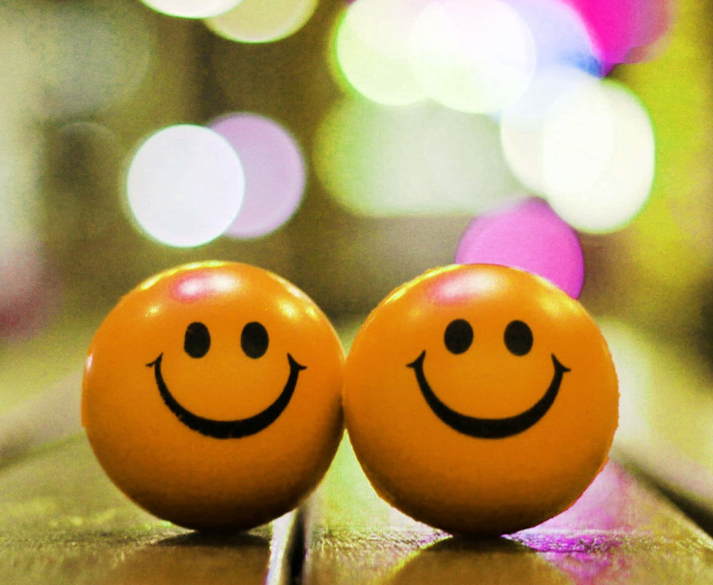 orange smiley face balls, wooden surface, colorful bokeh lights, Full HD Desktop Wallpaper