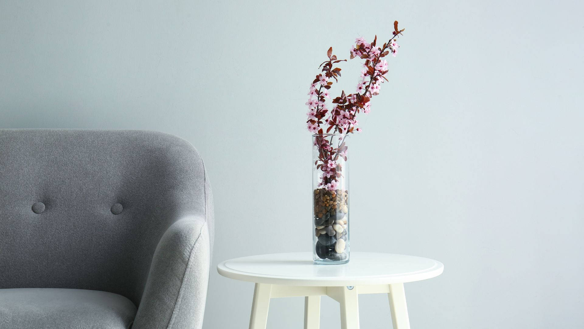 gray tufted armchair, white side table, tall glass vase, Full HD Desktop Wallpaper