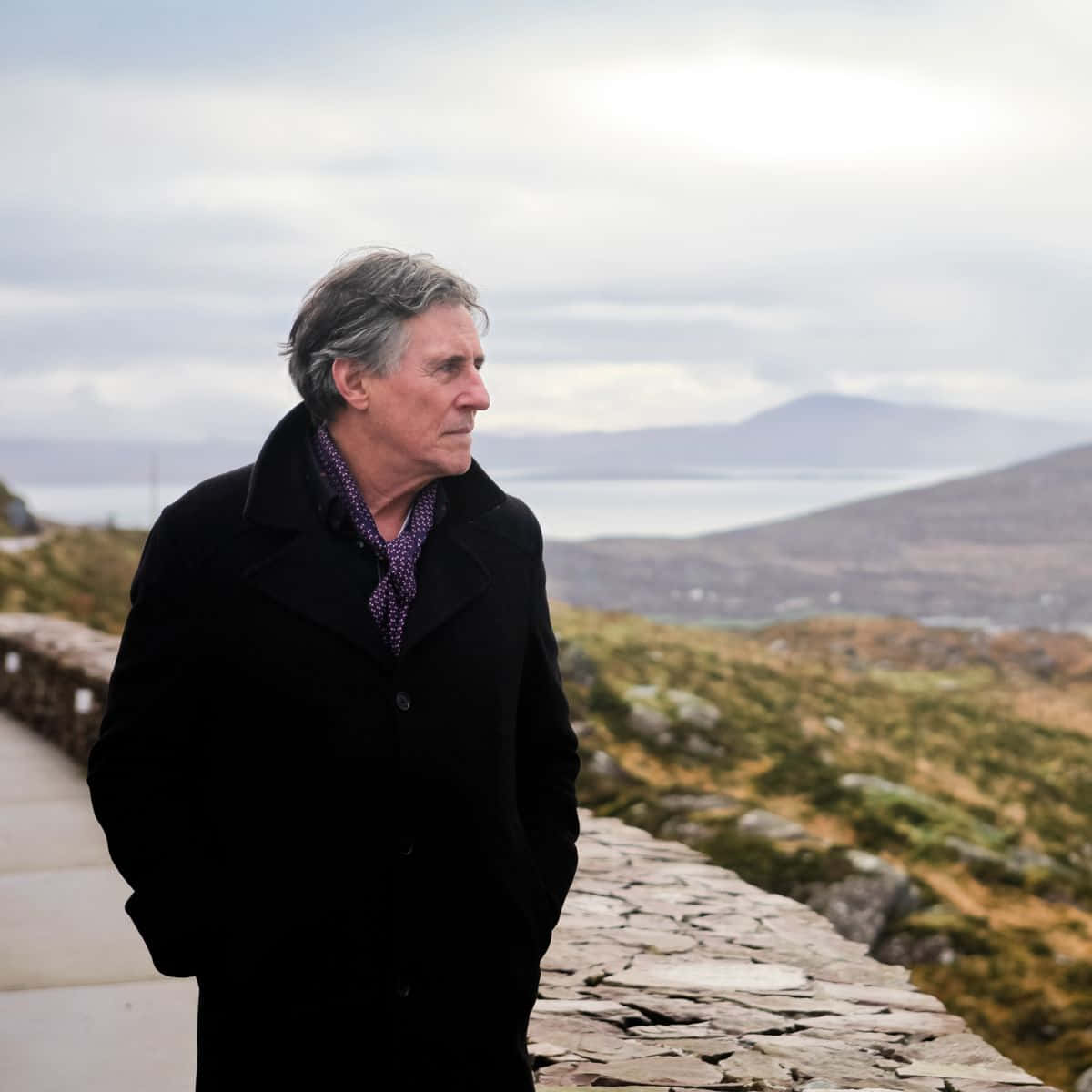 Gabriel Byrne, black coat, stone path, SD Desktop Wallpaper